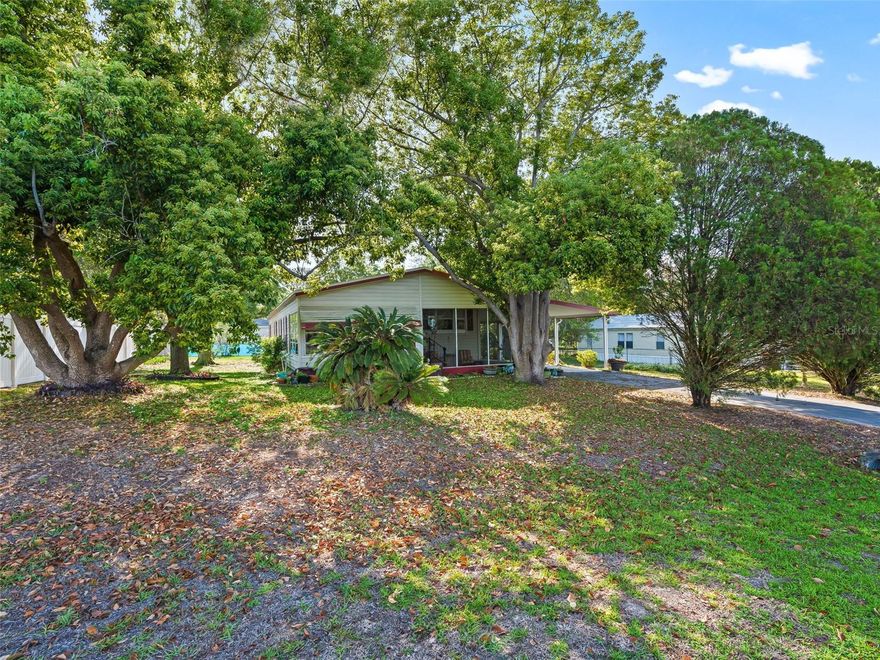 Exceptional Value & Move-In Ready in Belleview! This expansive 2-bedroom, 2-bathroom home offers a generous open layout, providing the perfect canvas for comfortable Florida living. You can move in with absolute peace of mind knowing the major high-ticket items have already been addressed: New Roof installed in 2024 and a New Central HVAC system installed in 2025.

The interior highlights versatile living areas, offering ample space for a home office, hobby room, or entertaining guests. Inside the heart of the home features a functional kitchen with a breakfast bar, excellent for casual dining and extra prep space. The property includes a versatile workshop/utility room conveniently attached to the carport, for extra storage or DIY projects.
Situated on a spacious lot in an established neighborhood, this property provides generous space to spread out both inside and out. Ideally located for both convenience and lifestyle, this home is just a short drive to The Villages, placing the vibrant dining, shopping and world-class entertainment of Spanish Springs Town Square right at your fingertips. You will also enjoy being close to both Lady Lake and Ocala, offering easy access to the region's best amenities. No HOA or lot fees! Enjoy the security of full land ownership with this property.