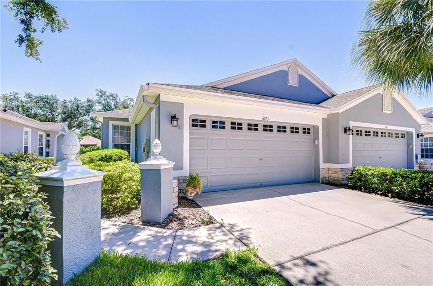 Welcome to the gated community of Sandhill Place in the highly sought-after FishHawk Ranch! Tucked away on a peaceful cul-de-sac lined with friendly neighbors, this charming maintenance-free villa offers the perfect blend of comfort, privacy, and easy living. From the moment you arrive, you’ll appreciate the serene setting and inviting curb appeal that make this home truly special. Inside, the open-concept design is filled with natural light, creating a warm and welcoming atmosphere throughout. Triple sliders in the great room provide the perfect setup for seamless indoor-outdoor entertaining. An arched entryway leads to the spacious breakfast nook, complete with double windows that brighten the space — the perfect spot to enjoy your morning coffee or casual meals. The kitchen is sure to impress with stainless appliances, abundant cabinet and counter space, and a convenient breakfast bar ideal for gathering with family and friends. Privately situated on one side of the home, the spacious primary suite offers a tray ceiling, spacious closet, and an en-suite bath with dual sinks, and spacious shower. The split floor plan offers an additional bedroom with comfortable carpet flooring and a nearby second bathroom, providing privacy and flexibility for guests or family members. A den/home office creates the perfect flex space for working from home, hobbies, or a cozy retreat. One of the standout features of this villa is the oversized L-shaped screened lanai, offering exceptional outdoor living space with plenty of room for lounging, dining, and entertaining year-round. Surrounded by privacy shrubs, this inviting outdoor retreat is the perfect place to relax and enjoy Florida living at its finest. Residents of Sandhill Place enjoy access to their own private community pool, along with all the incredible amenities FishHawk Ranch has to offer, including resort-style pools at the Aquatic Center, miles of scenic trails, a Skate Park, Fitness Center, Park Square, and access to top-rated Hillsborough County schools.