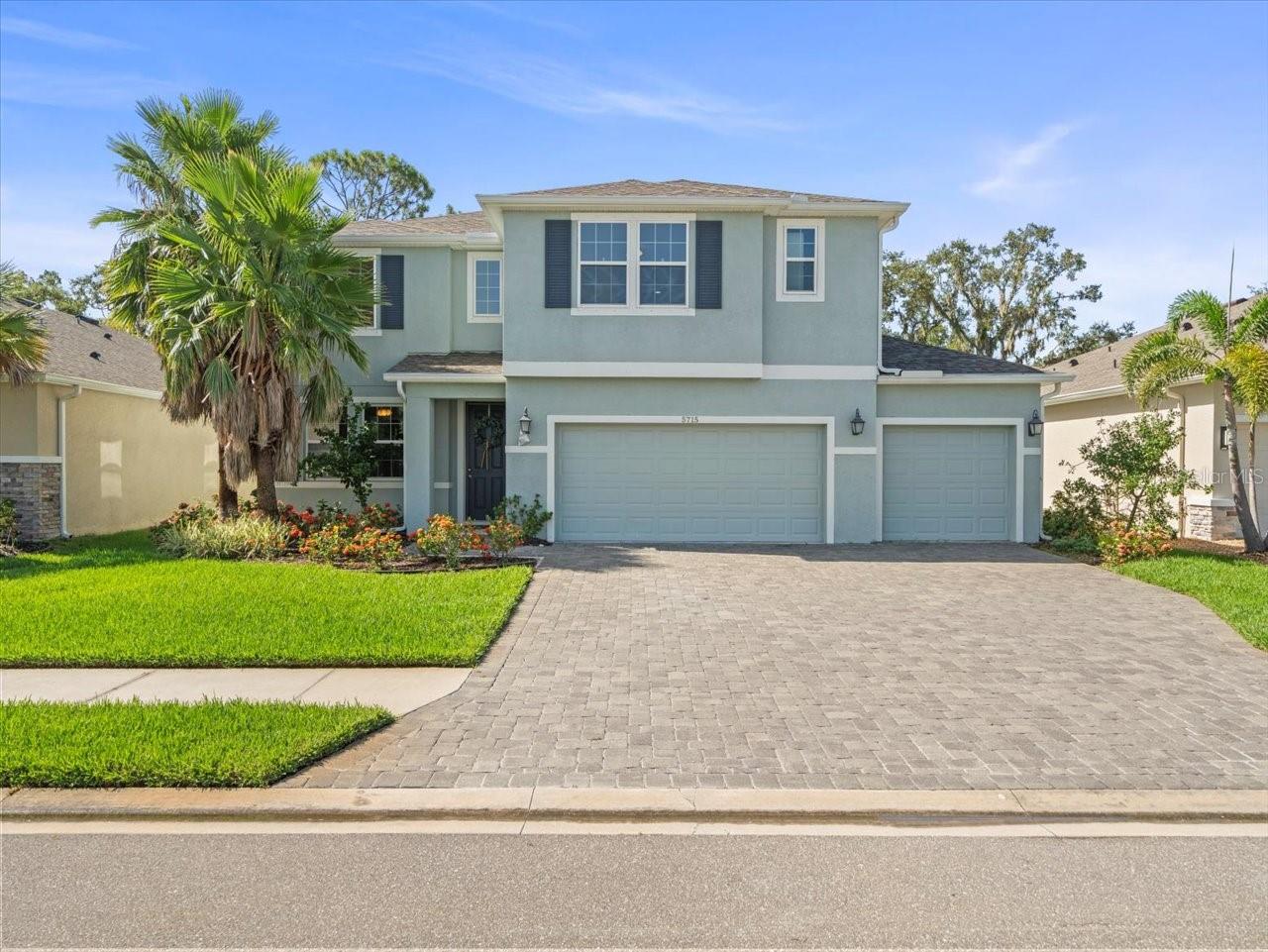 Welcome to your dream home in the prestigious gated section of Trevesta in Palmetto, Florida — a thriving, master-planned community where comfort, luxury, and lifestyle converge. Perched on an oversized conservation lot with a fully fenced backyard, this stunning 5-bedroom, 3.5-bath, 3-car garage home offers the perfect blend of privacy, space, and elegant design. Built in 2018 and featuring a brand-new roof (2025) and brand-new carpeting throughout, this home is completely move-in ready and radiates pride of ownership from every corner. Step through the front door and into a thoughtfully designed main level, where you’ll find a versatile flex room ideal for a formal dining room, home office, or den—tailored to fit your lifestyle. The chef’s kitchen is nothing short of spectacular, boasting gorgeous granite countertops, a large center island, rich 42” espresso cabinetry, and two pantries—including a walk-in pantry that’s every organizer’s dream. This open-concept layout flows seamlessly into the breakfast nook and spacious family room, creating unobstructed sight lines ideal for entertaining or simply enjoying time with loved ones. Also on the main floor is a guest suite with a walk-in closet and private en-suite access, making it perfect for visitors or multigenerational living. A conveniently located half bath is positioned off the family room for guests.
Upstairs, discover four more bedrooms, including a luxurious primary suite featuring multiple closets, a soaking tub, a tiled walk-in shower, and a dual-sink vanity adorned with solid surface countertops. The massive upstairs flex room offers endless possibilities—create a home theater, a game room, a gym, or a second living area; the choice is yours. Community Highlights: Trevesta is one of Palmetto’s most sought-after communities, known for its resort-style amenities and vibrant lifestyle. Residents enjoy a zero-entry pool, state-of-the-art fitness center, splash pad, multiple playgrounds, serene walking trails, and beautiful community landscaping. The HOA includes high-speed internet, cable, and gated security, providing peace of mind and outstanding value. This is more than just a house—it’s a lifestyle upgrade in one of Manatee County’s most exciting and well-connected neighborhoods. Located minutes from I-75, I-275, shopping, restaurants, and Florida’s gorgeous Gulf beaches, this home checks all the boxes. Don’t miss your opportunity to own this incredible home in Trevesta—call your real estate professional today for your private showing!