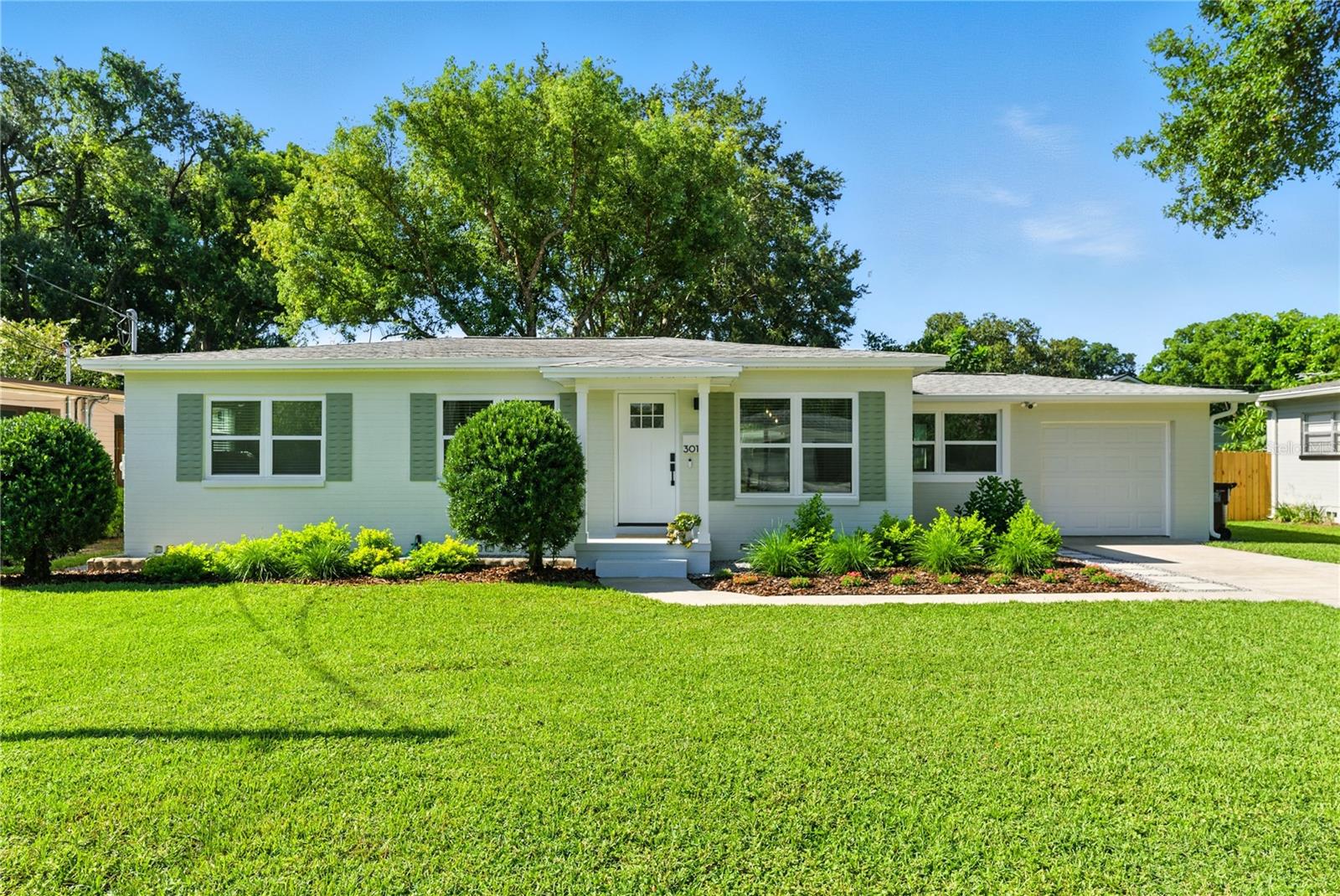 Welcome to 3016 Hargill Drive, a truly one-of-a-kind home where thoughtful design, high-end finishes, and meticulous renovations come together in the heart of Orlando’s vibrant Hourglass District. Every inch of this property has been intentionally transformed with style, quality, and lifestyle in mind creating a home that is as beautiful as it is functional. Step inside to discover a warm, curated space that feels like it belongs in the pages of a design magazine. Refinished original oak hardwood flooring runs throughout, preserving the home’s historic charm while providing durable, elegant surfaces that elevate the entire space. The heart of the home is the stunning chef’s kitchen, featuring custom sand shaker cabinetry with deep base drawers, Calacatta Storm White quartz countertops, a handmade Zellige tile backsplash, and top-of-the-line appliances - including a stainless steel LG refrigerator, range, dishwasher, and laundry tower, plus a Bosch drawer microwave and downdraft exhaust. Sophisticated lighting choices like West Elm fixtures and under-cabinet motion-sensor accents add the perfect finishing touch. The bathroom has been completely reimagined with floor-to-ceiling tile, sleek Kohler and Moen fixtures, and thoughtful additions like toe-kick lighting for a hotel-style experience at home. Every detail has been considered, from all-new interior and exterior doors, baseboards, and trim, to dimmable LED recessed lighting and stylish Hunter ceiling fans throughout. Behind the walls, the upgrades are just as impressive. The home has been fully rewired and repiped, with updated ductwork, new insulation, and all-new energy-efficient windows. Even the crawlspace has been professionally encapsulated, ensuring long-term structural integrity and improved air quality. A newer roof (2021), updated drywall, fresh paint inside and out, and smart home features including Google Nest thermostat and security cameras add comfort and peace of mind. Out back, the home sits on nearly a quarter-acre of beautifully landscaped space, with mature trees and fully fenced, ready for you to enjoy. A generously sized patio creates the perfect setting for entertaining or dining al fresco, surrounded by lush greenery, granite rock borders, and new sod. There’s plenty of room to add a pool, home addition, or garden studio - the possibilities are endless. A detached shed offers even more potential: perfect for storage, or easily converted into a home office, fitness room, or creative workspace. A freshly painted one-car garage with a new opener completes the picture. Located on a quiet, tree-lined street just steps from the local favorites of the Hourglass District, this home offers the best of both worlds - the feel of a peaceful retreat with the walkability of a connected lifestyle. Zoned for Lake Como K-8 and Boone High School, and with no HOA, this is a rare opportunity to own a beautiful home that has been renovated with precision in a prime location. To see the full scope of upgrades, please request the complete feature sheet. Homes like this don’t come around often. Call today for your private showing!