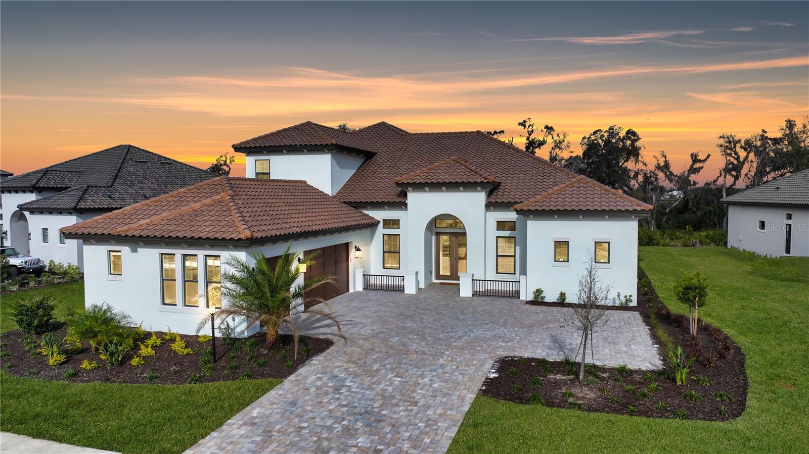 Priced to Sell! $150,000 Price Adjustment in Azario at Lakewood Ranch! Play golf immediately with no waitlist, and enjoy the luxurious resort lifestyle. This brand-new golf-deeded Beacon floor plan is one of Taylor Morrison's larger designs and is no longer being built in the community. This residence boasts four bedrooms, four full baths, two half baths, and a spacious three-car garage. The main living area is thoughtfully designed with a great room floor plan with access to the primary suite, two guest rooms, a powder room, and a private office. The kitchen is a chef's dream, featuring stainless appliances, an expansive center island, pass-through dry bar to the formal dining, and a dinette area—ideal for entertaining. The tall and extensive cabinetry in the kitchen was chosen to feature ample storage, glass fronts for display, and under-cabinet lighting. Pocket sliders open from the great room to the lanai, overlooking a serene preserve setting and there is plenty of room for a pool. Primary suite is a peaceful oasis with private access to lanai, two walk-in closets, and a stunning bath offering a huge double shower, and split vanities. The second level unveils a generous bonus room, which can be used for a second living room, home gym, media space, and much more. It also features a powder room and an en suite bedroom, providing a perfect private retreat. The home features hardwood floors all throughout, 12-foot ceilings, quartz countertops, crown moldings, tray ceilings, frameless glass showers, ample storage spaces throughout, tile roof, three AC zones ensure comfort throughout, and so much more. Best of all, this home is under warranty by Taylor Morrison until December 2024. Azario Esplanade offers maintenance-free resort living with a Culinary Center, championship golf, a heated lagoon-style pool, spa, fitness centers, tennis and pickleball courts, and a full social calendar. Immerse yourself in the epitome of resort-style living at its finest in Lakewood Ranch! Lakewood Ranch is the number one best-selling, multigenerational community in the country and located near world-class shopping, dining, entertainment of Lakewood Main Street, University Town Center, downtown Sarasota and is minutes to I-75, beaches, great schools and medical facilities.