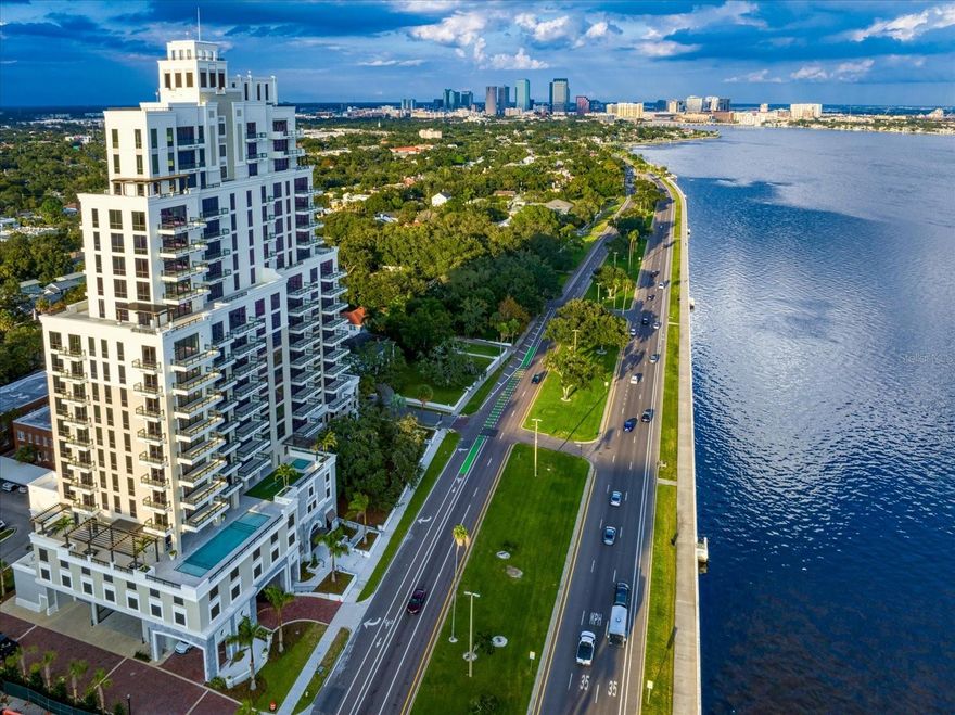 Discover an exceptional new standard of living at Hyde Park House, an elegant 22-story residential tower offering just 70 exclusive residences along iconic Bayshore Boulevard. Perfectly positioned in the heart of historic Hyde Park, The Chester residence spans over 2,000 square feet and is thoughtfully designed for both comfort and privacy. This split-bedroom floorplan features two spacious bedrooms, a versatile den, and three full bathrooms. The den is appointed with a built-in wall bed that effortlessly converts to a desk, making it ideal as either a guest room or a private home office. An oversized terrace extends your living space outdoors, with access from both the Great Room and Owner's Suite — ideal for enjoying the tree tops of Hyde Park. Interiors showcase high-end finishes throughout, including 10-foot ceilings, expansive layouts, and large-format porcelain tile flooring. The chef-inspired kitchen is appointed with European-style cabinetry, quartz countertops, premium Gaggenau appliances, gas cooktops, and an Electrolux front-load washer and dryer. Hunter
Douglas electronic remote-controlled blinds included throughout. Furniture is negotiable. The building features a whole-building water softener system, a hot water supply system and a central cooling infrastructure designed for efficiency and comfort. The residence is served by the building's condenser water loop, which circulates chilled water throughout the tower. Your individual AC unit is powered by electric fans, meaning your electric bill will reflect energy used while your AC is running — a straightforward and transparent utility structure that puts cooling costs directly in your control. Residents enjoy a curated collection of resort-style amenities on a beautifully landscaped waterfront plaza, including a pool and spa, outdoor summer kitchen with gas grill, fire pit, fitness center, and social lounge. The building also offers a secure private parking garage, access-controlled entry, climate-controlled storage, and 24-hour front desk attendant. Tampa International Airport is just 20 minutes away. With its rare blend of modern luxury and walkable access to Hyde Park's renowned shopping, dining, and nightlife, Hyde Park House is one of South Tampa's most prestigious residential addresses.