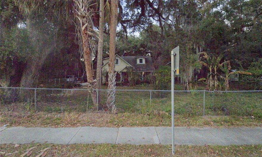 Prime REDEVELOPMENT OPPORTUNITY on SR-26 (Newberry Road). Located in an OPPORTUNITY ZONE, and within the Gainesville CRA, the possibilities for this parcel are many. The greatest value is in the land -  Over ONE acre, with possible  2nd access on the back from NE 18th Terrace, this land is zoned for five units per acre - however the FUTURE USE shows Low Density Residential, allowing upto 15 dwelling units per acre.