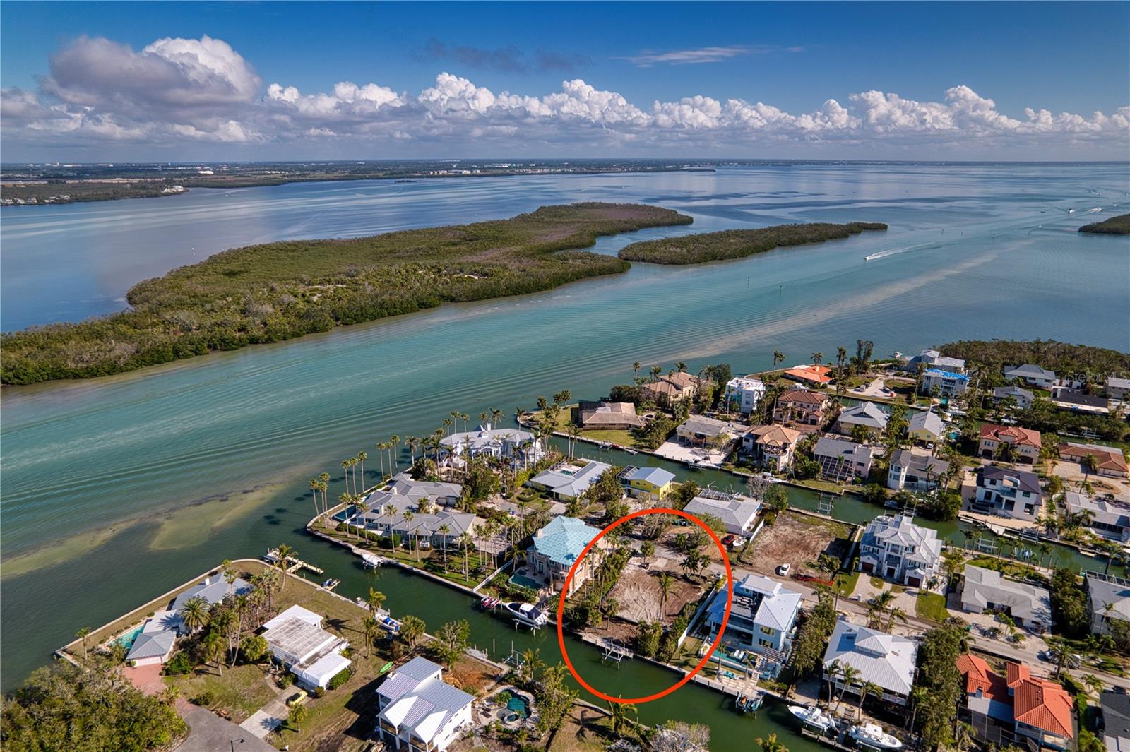 Build Your Dream Waterfront Oasis on Longboat Key! Discover the ultimate in Florida coastal living with this cleared and build-ready vacant lot on coveted Longboat Key. Featuring a 80ft wide seawall, private boat dock, and 10,000lb lift, this prime property offers direct access to the bay, making it a boater’s paradise. Cruise out to explore the Gulf of Mexico or enjoy serene sunsets on the bay from your backyard.
Nestled in one of the most prestigious areas along the Gulf Coast, Longboat Key boasts an exceptional lifestyle. Known for its pristine beaches, world-class golf courses, and exclusive resorts, this island gem combines natural beauty with luxury living. Enjoy easy access to fine dining, boutique shopping, and cultural attractions in nearby St. Armands Circle and downtown Sarasota.
Whether you're drawn to the island's peaceful charm, abundant wildlife, or active lifestyle, Longboat Key has it all. From kayaking and paddleboarding in the bay to relaxing on uncrowded sandy shores, every day feels like a vacation.
This lot is the perfect canvas to design and build your custom dream home, complete with water views and the amenities you’ve always desired. Don't miss this rare opportunity to live on prime boatable water in one of Florida’s most sought-after destinations!