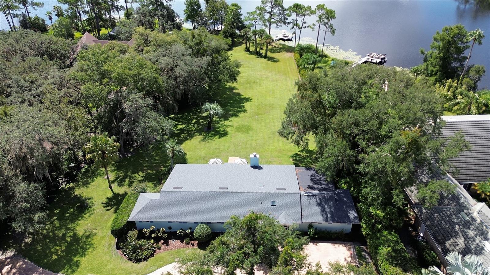 Just Listed, Beautiful Lake Front Home! NO HOA!! Lake Mamie is spring fed and covers 238 acres of pristine bountiful water filled with turtles, Bass and Brim for great fishing. Private boat launch on property as well! Enjoy your morning cup of coffee on the Dock watching the sunrise. Dusk to Dawn lighting on the dock. Plenty of room to roam around on this property that sits on 2.7 acres with gorgeous panoramic views of the water from almost every room in the home. New beautiful pavers recently placed on the long winding driveway for a grand entrance to this one of a kind stunning home. 16x24 detached multi purpose room to be used as anything you want it to be with AC mini split just added, new windows, new paint, new stucco and pull out sofa bed and has been fully wired for and includes a Generac Generator. Huge Bonus is that there is a separate detached Bomb/Storm shelter on the property. This is a huge bonus to the property, especially to have in Florida! Escape to your private shelter where you will always feel safe on your property at all times during any type of crisis. This home comes fully furnished, bring your bags and just move in! The spacious home is light and bright and the Roof, Water Heaters and AC were replaced in 2018. New landscaping, freshly painted. 2 water heaters on the property. Lake fed irrigation system to save tremendously on your water bills. Very low electric bills as well ranging from $200 to $250 a month. Termite Bond on the property. Brand New Deck behind the property with wheelchair access. High elevation and the property has never flooded. New Luxury Vinyl installed in 2022. Only minutes away from the famous Downtown Deland area where there are always fun events going on with incredible restaurants to choose from. Conveniently close to shopping, medical facilities, restaurants and only an hour away from all the theme parks. DeLeon Springs and Blue Springs are only a short drive away as well as our Beautiful Beaches. Have a beach day with just a 35 min drive away. Very centrally located and waiting for its new owners to enjoy all that this amazing one of a kind property has to offer. Give us a call today to schedule your private showing.