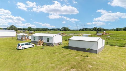 Photo of 1427 NW 102nd Boulevard, Wildwood, FL 34785 (MLS # OM705997)