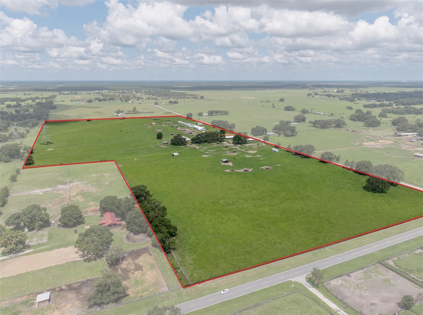 ***UNDER APPRAISED VALUE***. Appraisal completed May 2025; survey completed in 2024. This farm is a phenomenal working facility in an excellent location 10 minutes from Ocala line, less than 30 minutes to the World Equestrian Center and less than 15 minutes to the Florida Horse Park. Easy access to both Tampa and Orlando International airports. The entire 70-acre farm which includes four parcels is priced at 4 million. Each parcel can be purchased independently, ask for details. This fantastic facility was built over the past two years. Almost every part of this farm is BRAND NEW! This farm was created with easy maintenance in mind.
• NEW perimeter fencing 4 Board
• (6) NEW large pastures
• (16) NEW paddocks
• NEW auto waterers in every field and every stall
• NEW gates
• (16) NEW pasture and paddock shelters
• (3) NEW residential stick-built homes NOT mobile homes
• (1) primary block home, new pool (2024) and new hurricane windows (2024), new septic system (2022)
• 28 stalls throughout 3 barns (2 of these barns are brand NEW)
• 1st barn remodeled 8 stalls, cameras, fly spray system, auto waterers, feed & tack room, wash rack with hot and cold water
• 2nd barn NEW 6 stalls with breeding stocks, fly spray system, auto waterers
• 3rd barn NEW over 8,000 sq ft with office, break room, laundry room, tack room, wash rack hot and cold water, cameras above each stall and a ton of storage
• NEW hay barns
• NEW shavings barn
• NEW storage barns
• NEW shop and 7 bay garage for equipment
• NEW arena
• NEW round pen
• NEW privacy Fence
• NEW She Shed
• Outside shower and bathroom
• Hot walker
• (2) Camping spots with water, electric and sewer
• 2 Electric gates operated by remote controls or the key pad
• Reptile cage or chicken coop
• Save on hay for your horses or cows! Grass has been fertilized and seeded year after year!