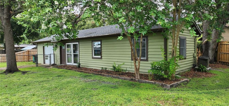 UPDATE: Seller may contribute toward buyer's closing costs with an acceptable proposal! BRING YOUR BOAT or RV to this updated Safety Harbor home with an oversized fenced lot!! No Deed Restrictions, NO Flood Insurance and NO HOA! Newer roof, updated kitchen, and newer wooden privacy fence all installed in 2022.  Enter the open living room and dining room and view the sweet backyard through double atrium doors with built-in shades. Access the kitchen from the hallway or the dining area. Many upgrades include kitchen cabinets, counters and appliances, vinyl flooring throughout, a bathroom vanity, sink, and bidet. Separate laundry room with washer and dryer is inside! 2 spacious bedrooms have ample closet space.  Air conditioned 1 car garage was previously an additional bedroom and can easily be converted into living area. Walk or ride to historic downtown Main Street with numerous shops and restaurants, special events and fabulous library. Very close to Philippe Park, The Marina Park and Safety Harbor Resort and Spa. Pedestrian and bike trail now goes into Tampa connecting Bayshore Blvd with the Courtney Campbell Causeway. This home is only footsteps from Safety Harbor Elementary School and Safety Harbor Middle School. Enjoy the freedoms of living in a non deed restricted neighborhood with NO HOA Fees! Life is good in the Harbor!