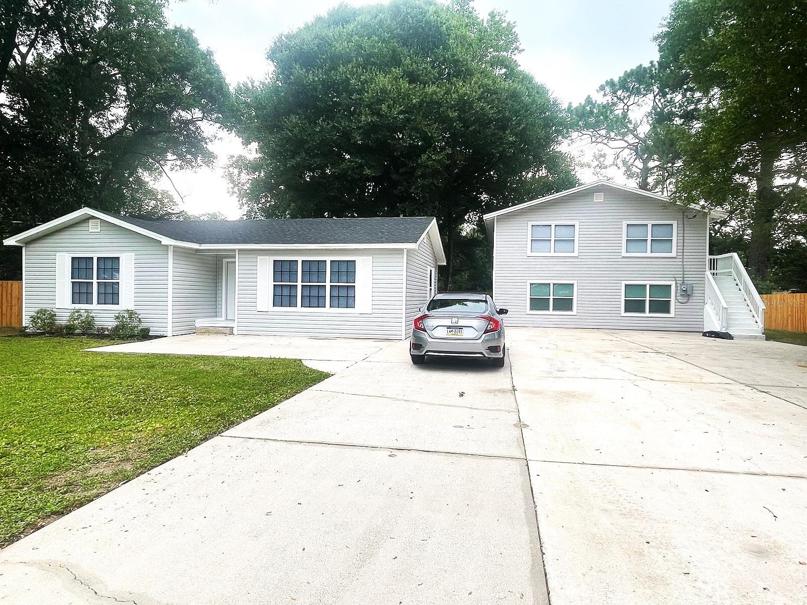 This beautifully updated three-bedroom home provides an outstanding modern living experience in a tranquil neighborhood, complete with a generously sized, fully renovated approximately 1,062 square feet. Recent enhancements include a new roof, updated plumbing, modern HVAC systems, stylish cabinetry, stainless steel appliances, contemporary bathroom fixtures, and extensive electrical rewiring. A new well pump and pressure tank have also been installed. With ample parking available, this property offers fantastic potential! It flawlessly combines comfort, functionality, and style. The home has brand-new appliances, an upgraded HVAC system, a washer and dryer, and high-quality finishes, creating an exceptional environment for you and your family. (Please note that furniture is not included.) Each of the three spacious bedrooms offers privacy, and a bathroom is available. It is the tenants' responsibility to verify the room dimensions.
