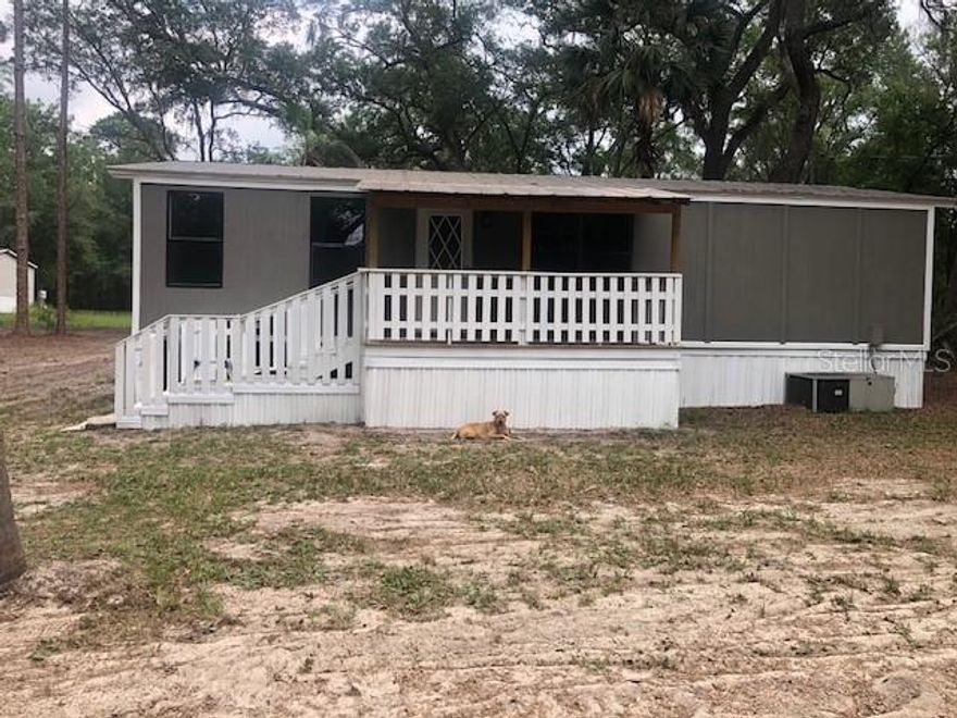 Charming Rural Retreat in Ft. McCoy, FL – Just Minutes from Ocala   (NEW ROOF- AUGUST 2025)
Looking to enjoy the peace and charm of small-town living while staying close to all the amenities of Ocala? This well-maintained 3-bedroom, 2-bath mobile home in Ft. McCoy offers the best of both worlds on nearly half an acre of freshly cleared land.
Step into a spacious 24’ x 40’ residence featuring a large front living room with direct access to a newly built, covered wooden porch—perfect for enjoying quiet mornings or relaxing evenings outdoors.
Inside, you'll find a thoughtful layout with three comfortable bedrooms. The primary bedroom boasts a walk-in closet, while bedrooms two and three with double-door closets. Both full bathrooms have been updated with new toilets for your convenience.
The generously sized kitchen features newly updated lower cabinets with sleek countertops, freshly painted upper cabinets, and modern appliances—including a stainless-steel double sink, refrigerator, dishwasher, range/oven, and large overhead vent. There's plenty of room for a dining table, making this space ideal for family meals or entertaining guests.
Additional highlights include:
• Fresh laminate flooring throughout the home
• Fresh interior and exterior paint
• Utility room with washer/dryer hookups and access to a second covered wood porch at the back of the home
• A 75’ x 125’ cleared lot PLUS an additional adjoining 75’ x 125’ cleared lot—nearly half an acre total
Located on a quiet rural road just outside of Ft. McCoy, this property offers the tranquility of country living with the convenience of being just a short drive from Ocala. Whether you're starting out, downsizing, or looking for a peaceful getaway, this home is a must-see.
Schedule your private showing today and picture yourself living the laid-back Florida lifestyle!