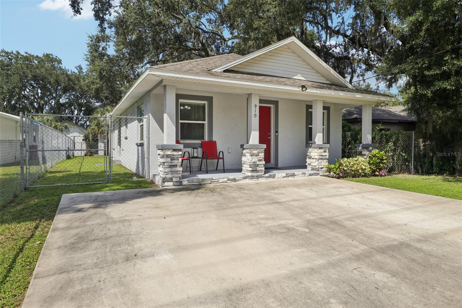 Own a standout 3-bedroom, 2-bathroom, 1300 square foot bungalow at 910 E Alabama Street, Plant City, Florida, built in 2021 for buyers who want quality and zero compromises. Set in the fast-growing heart of downtown Plant City, this home puts you steps from top dining, shops, and events while keeping a private, functional vibe. The open-concept 17x16 great room gets tons of light through double-paned, energy-efficient vinyl windows, ideal for hosting or relaxing. The kitchen delivers with granite countertops, custom soft-close cabinetry, a sharp breakfast bar, premium Frigidaire appliances, and precise Delta faucets. The 15x13 primary suite gives you serious space, and both bathrooms feature crisp white subway tile showers for an upscale edge. Outside, a large, cleared backyard is ready for barbecues, play, or gardening, paired with a modern storage shed for tools or projects. A high-end washer and dryer make daily life effortless. The 5x25 covered front porch with bold stacked stone pillars grabs attention, and a two-car concrete parking pad adds convenience. With 50 LED can lights throughout, you get energy savings without losing style. This move-in-ready home is a rare find in vibrant Plant City. Features a high-end modern washer and dryer, backyard storage shed, versatile backyard, energy-efficient windows and LED lighting, granite countertops, custom cabinetry, Frigidaire appliances, Delta faucets, covered front porch, two-car parking pad. Schedule a tour today.
