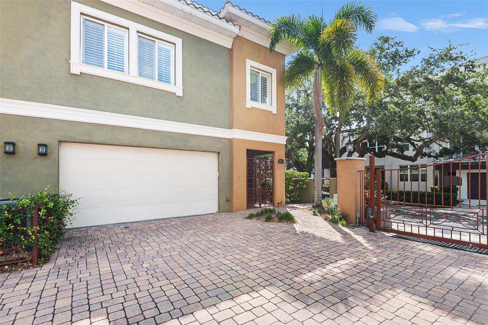This absolutely stunning end-unit townhome for rent in a gated community on the highly desirable Bayshore Blvd exudes luxury from the moment you step inside. Spanning three floors, each level offers its own balcony or patio space, creating an inviting blend of indoor and outdoor living. The main floor features a huge gourmet kitchen with stone countertops and stainless steel appliances, seamlessly connecting to the living and dining areas, with French doors opening to a private patio. After a long day, ride the elevator to the second floor, where the primary suite awaits, complete with a spa-like ensuite bathroom featuring a walk-in shower, soaking tub, and dual sinks. The third floor offers an in-law-style suite with a private bedroom, bathroom, and a dedicated home office space, complemented by an oversized outdoor lanai perfect for relaxation. Ideally situated, this home is steps away from the scenic Bayshore Blvd, perfect for walking, running, or biking, and just minutes from downtown Tampa and Hyde Park’s fine dining, retail, and entertainment. This townhome embodies luxury and will surpass your every expectation.