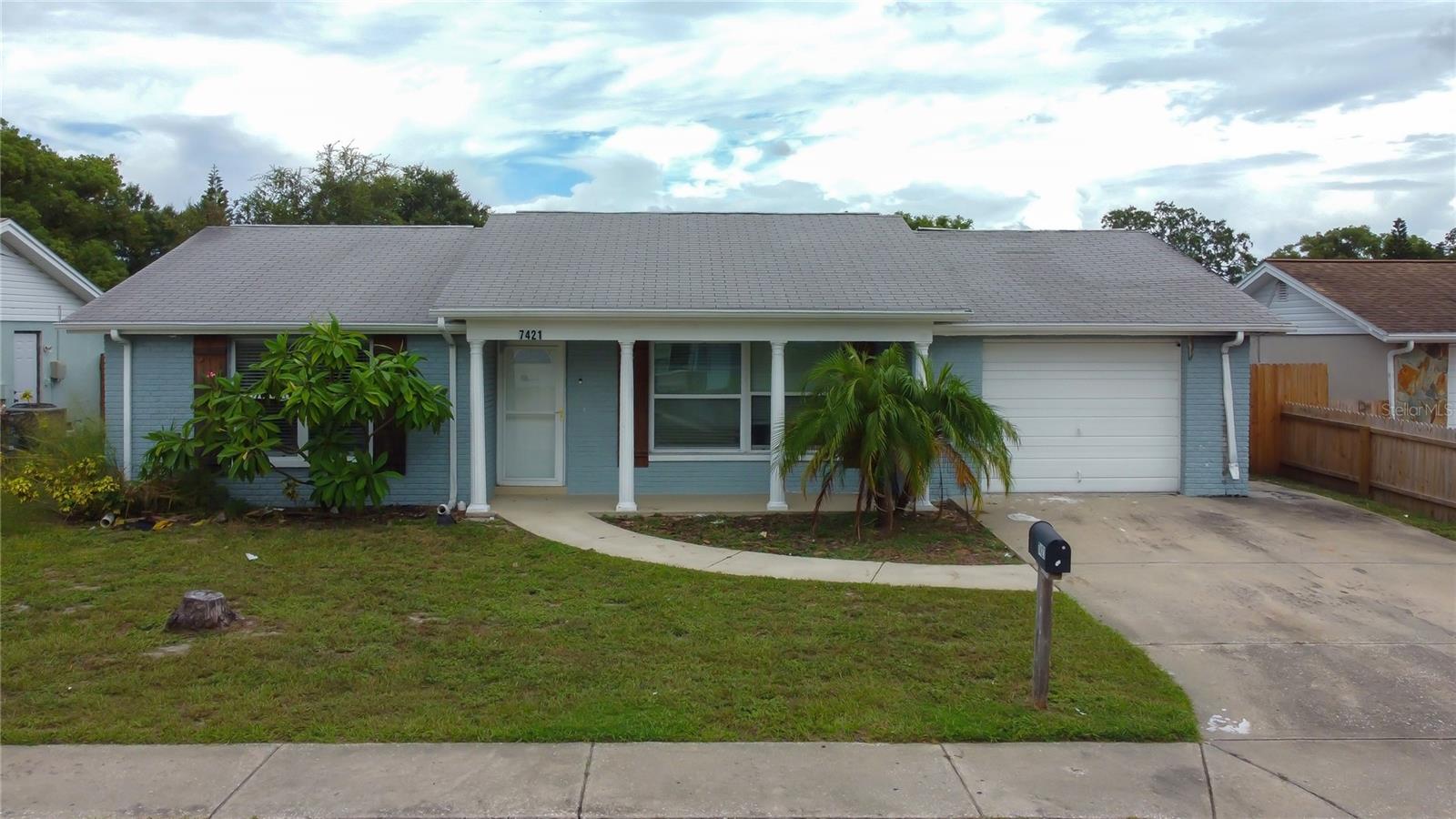 This lovely 3 bedroom, 2 bath home offers a fantastic opportunity for a savvy buyer or investor. While the garage area sadly suffered fire damage in January, the rest of the home shines with stylish upgrades and a functional layout. Step inside to attractive wood-look, plank tile flooring throughout the entire home (low maintenance - no carpet anywhere!). The kitchen has an abundance of cabinet space, a closet pantry and is complimented by granite countertops, stainless steel appliances and a cozy dinette area. The versatile split floor plan allows for comfort and privacy. The comfortable primary suite with sliders leading to the patio and spacious fenced yard, features a built-in closet and walk-in closet, and the updated ensuite bathroom enhances its appeal with earthy tile tones and a step-in shower. There are two generously sized guest bedrooms and a modern guest bath with tub and shower. Energy efficient windows assist in maximizing natural sunlight creating a brighter inviting atmosphere. You’ll appreciate the freedom of no HOA or CDD fees and your new home is located in Flood Zone X! This fabulous location is just 2 blocks from Lake Lisa Park, perfect for children and pets with its playground and green space and just minutes to schools, medical facilities, shopping plazas and dining. Explore nature trails at nearby Werner-Boyce Salt Springs State Park, kayak on its natural springs or have a relaxing beach day at Robert R. Rees Memorial Park. Take a short drive to downtown New Port Richey and enjoy its waterfront restaurants, music, retail therapy and events at Sims Park! This property is awaiting the right buyer to recognize its charm and potential!