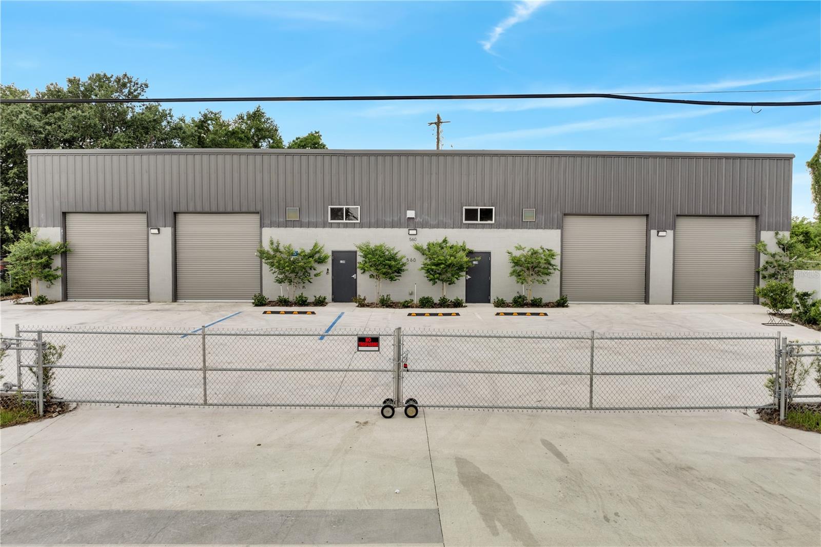 This premium commercial warehouse space, located in the heart of Orlando, is designed for versatility and operational efficiency. The newly constructed property offers a total of 5,678 square feet of warehouse area, along with 693 square feet dedicated to office use. The warehouse can be divided into two units, each featuring its own office and bathroom access as well as individual roll-up doors, making it suitable for owner use plus tenant rental or dual-tenant occupancy. Ceiling heights range from 18 to 20 feet, providing substantial vertical storage capacity and operational flexibility. Additionally, the facility is equipped with Three-Phase Power, ensuring robust electrical capacity suitable for industrial and commercial applications. The property is enclosed with fencing and gating, offering enhanced security and controlled access.
Situated in a highly accessible area of Orlando, just one block away from Highway 50, with easy connectivity to SR408, Florida's Turnpike, and Interstate 4. This property zoned C-3 is ideal for businesses seeking efficiency, security, and adaptability. Take advantage of this opportunity to secure this premium warehouse space.