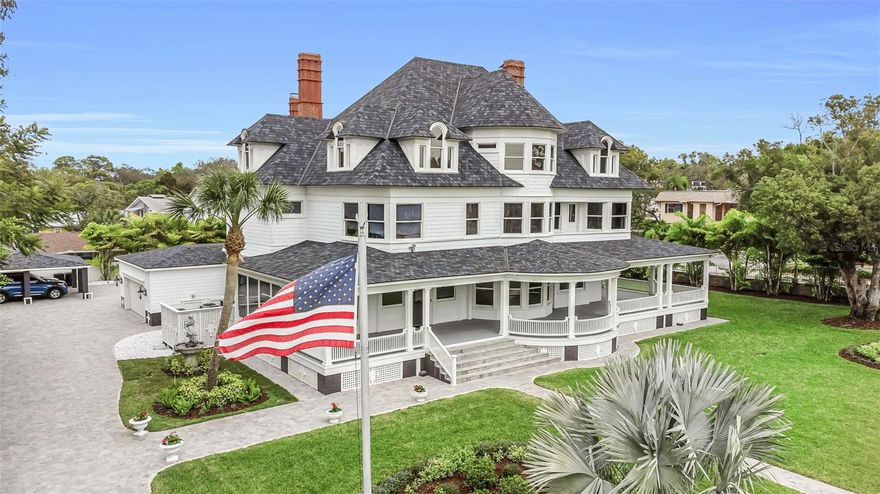 Nestled in the heart of Tarpon Springs , overlooking the scenic bayou renowned for its annual Epiphany celebration, stands a magnificent mansion constructed in the late 1800s by the esteemed inventor of the hacksaw, George Clemson, this historic residence is a testament to architectural brilliance and historical significance. With an imposing façade that whispers tales of yesteryears, this home is a sanctuary of elegance and splendor.
 
Spanning three floors, the estate boasts an impressive lineup of 11 bedrooms, 7 bathrooms, 2 kitchens, complemented by 5 fireplaces that add warmth and character to the space. The residence is adorned with rich dark woods that encapsulate its interior, narrating stories of royalty and distinguished history. The meticulous craftsmanship is evident in the choice of materials, with floors laid out in Dave County pine, and elements of chestnut, Rifca cherry, and walnut wood embellishing the home. A solid chestnut staircase elegantly connects all three levels, ensuring a seamless flow through the mansion's grandeur.
 
The first floor serves as the heart of the home, featuring a kitchen, a butler’s kitchen, and a butler's office/pantry for ultimate convenience. It also houses two bathrooms, an oversized dining room, a music room, a library, and a great hall - each space more enchanting than the last. Two fireplaces, a sunroom, and two reading nooks provide cozy retreats for relaxation and contemplation. The second floor is a haven of comfort with 7 bedrooms, including servant quarters, 4 bathrooms, 2 fireplaces, and a living room. The master suite, a pinnacle of luxury, opens up to a private balcony overlooking the tranquil bayou. The third floor comprises 4 additional bedrooms and 1 bathroom, offering ample space for family and guests.
 
The estate's exterior is as majestic as its interior, with a wrap-around driveway and a large porch that circles the perimeter, inviting moments of peace and enjoyment of the lush surroundings. Adding to the allure is a boat dock with private access, a basement, 2-car garage, and a 2-car carport, blending convenience with the luxury of waterfront living.
 
This is not just a residence; it's a piece of history encased in luxury, a marvel of design and craftsmanship that offers a rare opportunity to own a landmark estate in Tarpon Springs. This home is a tribute to the legacy of George Clemson and a beacon of heritage, standing proudly by the bayou, waiting to continue its story with you.