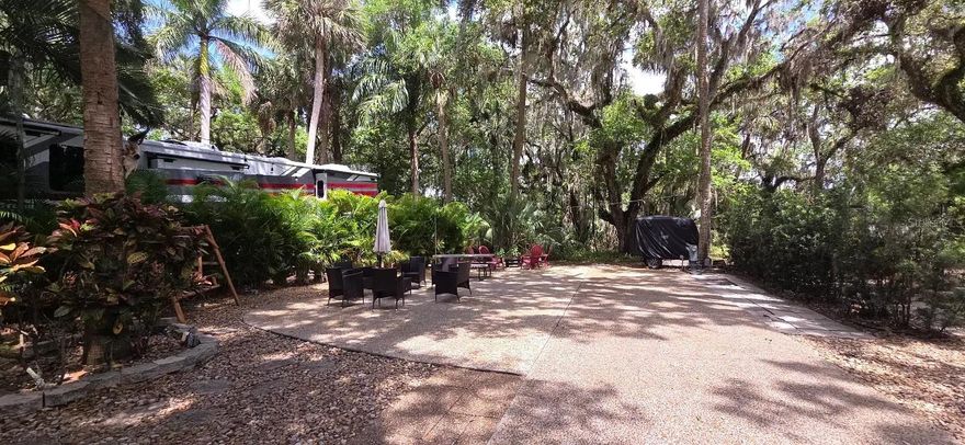 Looking for a LUXURY RV Lot to BUY in FLORIDA?  Look no further!  Full Privacy at this River Ranch Lot in Central Florida!  This gorgeous shaded Deeded RV Lot has no rear neighbors and offers serenity, shade and a peaceful private setting.  This property is located just steps from the Pool, Clubhouse, Laundry and Bathhouse.  The Lot will convey with furnishings and a grill.  Rent the Lot when not in use to off-set expenses.  Enjoy heated pools, pickleball, billiards, a workout room, steam room and more! 
Looking for entertainment and fun? River Ranch offers it here!! For starters, there is a LIVE Rodeo every Saturday night – an excellent display of showmanship and fun for the entire family! There is even a Saloon (family friendly), with LIVE bands, DJs, dance parties and they give line dancing lessons for free. There is a waterpark, an adventure park which has a bounce house, mechanical bull, climbing tower, Arcade, mini golf, outside movie on the greens, bicycle rentals, airboat rides, river boat rides, swamp buggy, hayrides, petting farm, trap & skeet range and a bow target for shooting. There are several places to eat on property. The River Ranch Chop House serves delicious food and drinks, a waterfront Smokehouse Grill serving delicious BBQ, a pizza shop and an ice cream and coffee shop (serving Starbucks.) There is also a General store and a Western store to grab all of your favorite Cowboy/Cowgirl finds! Watch the Bison, Steers, Horses and other wildlife! Don’t forget to check out the Petting Farm!!