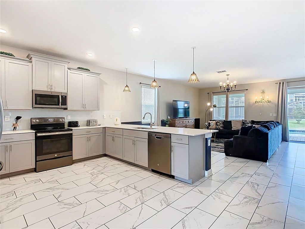 Photo of 303 Ocean Course Avenue, Davenport, FL 33896 (MLS # O6390864)