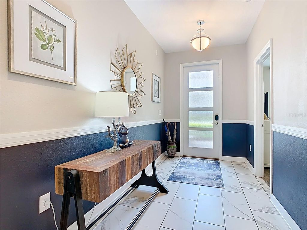 Photo of 303 Ocean Course Avenue, Davenport, FL 33896 (MLS # O6390864)