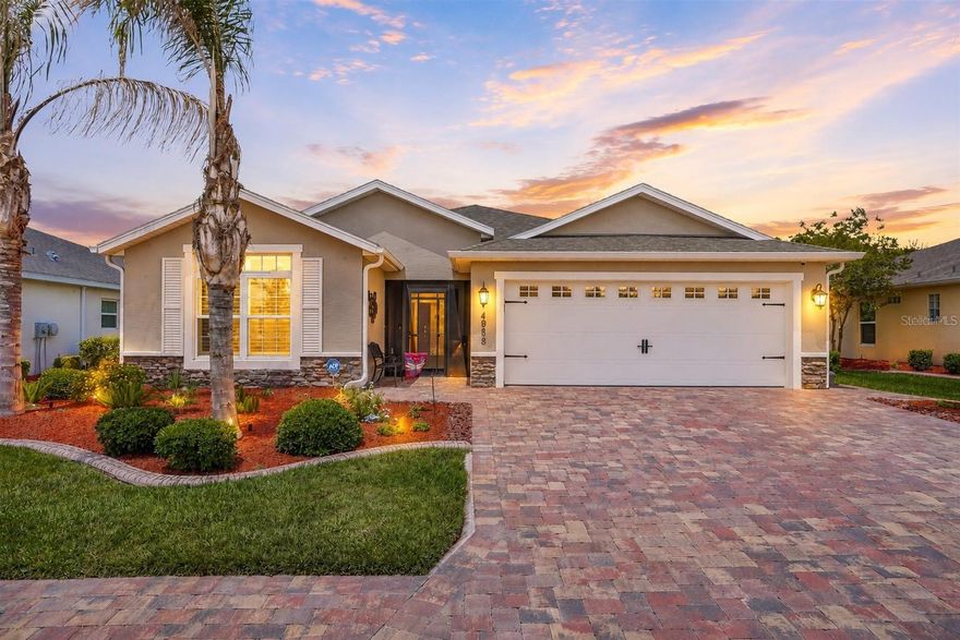 DESIGNER DETAILS, SUN-SOAKED SPACES & OUTDOOR LIVING PERFECTION!

If you’ve been waiting for that “this is the one” feeling… this is it.

Welcome to this BEAUTIFULLY UPGRADED and METICULOUSLY MAINTAINED Flamingo model in the highly sought-after, truly gated community of Lakeside Landings--where style, comfort, and Florida living come together effortlessly. Offering 3 bedrooms, 2 bathrooms, 1,889 sq. ft, and a SPLIT-BEDROOM LAYOUT, this MOVE-IN READY home is packed with thoughtful upgrades and standout features you simply do not see every day.

From the moment you arrive, the BRICK PAVER DRIVEWAY, IMMACULATE LANDSCAPING, CUSTOM-DESIGNED LANDSCAPE CURBING, and SCREENED FRONT LANAI with a REMOTE-CONTROL SUNSCREEN immediately set the tone. Step through the gorgeous DECORATIVE LEADED-GLASS FRONT DOOR into a grand foyer with a rare coat closet and take in the elevated details: CROWN MOLDING THROUGHOUT, PLANTATION SHUTTERS, DESIGNER LIGHTING, and TILE FLOORING — NO CARPET anywhere!

The kitchen is equal parts beautiful and functional with QUARTZ COUNTERTOPS, STAINLESS STEEL APPLIANCES, STYLISH SUBWAY TILE BACKSPLASH, PULL-OUT DRAWERS, UNDER-CABINET LIGHTING with DIMMER, breakfast bar seating, and a SOLAR TUBE that fills the space with NATURAL LIGHT. There is also a SECOND SOLAR TUBE in the indoor, dedicated laundry room. 

The primary suite is both SPACIOUS and thoughtfully designed, complete with a CHARMING BAY WINDOW, TRAY CEILING complete with CROWN MOLDING, DUAL CLOSETS, PLANTATION SHUTTERS, and an en-suite bath featuring DUAL SINKS, a PRIVATE WATER CLOSET, CEILING FAN, and a ROMAN SHOWER with no glass to clean!

And then… the real magic happens out back.

The GLASS-ENCLOSED LANAI features TRIPLE SLIDERS that open completely, ELECTRIC SHADES, and AIR CONDITIONING, creating a comfortable year-round INDOOR-OUTDOOR LIVING SPACE. Just beyond, the EXTENDED BRICK-PAVER PATIO offers the perfect place to entertain, grill, relax, or enjoy the peaceful backyard with ROOM FOR A POOL. Add in FRENCH DRAINS, EXTRA GUTTERS, and PRISTINE LANDSCAPING, and beauty meets function in all the right ways. This home's SOUTH-FACING ORIENTATION helps minimize harsh direct sun exposure, making the outdoor living spaces MORE COMFORTABLE and ENJOYABLE YEAR ROUND.

Even the garage impresses with a HEAVY DUTY EPOXY FLOOR, CEILING FANS, CUSTOM CABINETRY, and dedicated storage for bikes, beach chairs, fishing poles, and all your Florida toys.

Additional highlights include CLOSET SYSTEMS in all bedrooms, upgraded guest bath with glass shower door, WAINSCOTING, SOLAR TUBES, a WHOLE-HOUSE WATER SOFTENER AND FILTRATION SYSTEM, just to name a few. 

And let’s not forget Lakeside Landings, known for its resort-style pool with waterfalls, jacuzzi, fitness center, pickleball and tennis courts, basketball, dog parks, playground, billiards room, library, Lake Miona access, and a 13,000 sq ft clubhouse — all just minutes from The Villages where you can enjoy nightly entertainment, shopping and dining. Ideally situated just across from THE VILLAGES, with convenient access via STREET-LEGAL GOLF CART—enjoy the sought-after lifestyle without the premium price.

Impeccably cared for and truly MOVE-IN READY, this one deserves a spot at the top of your list.