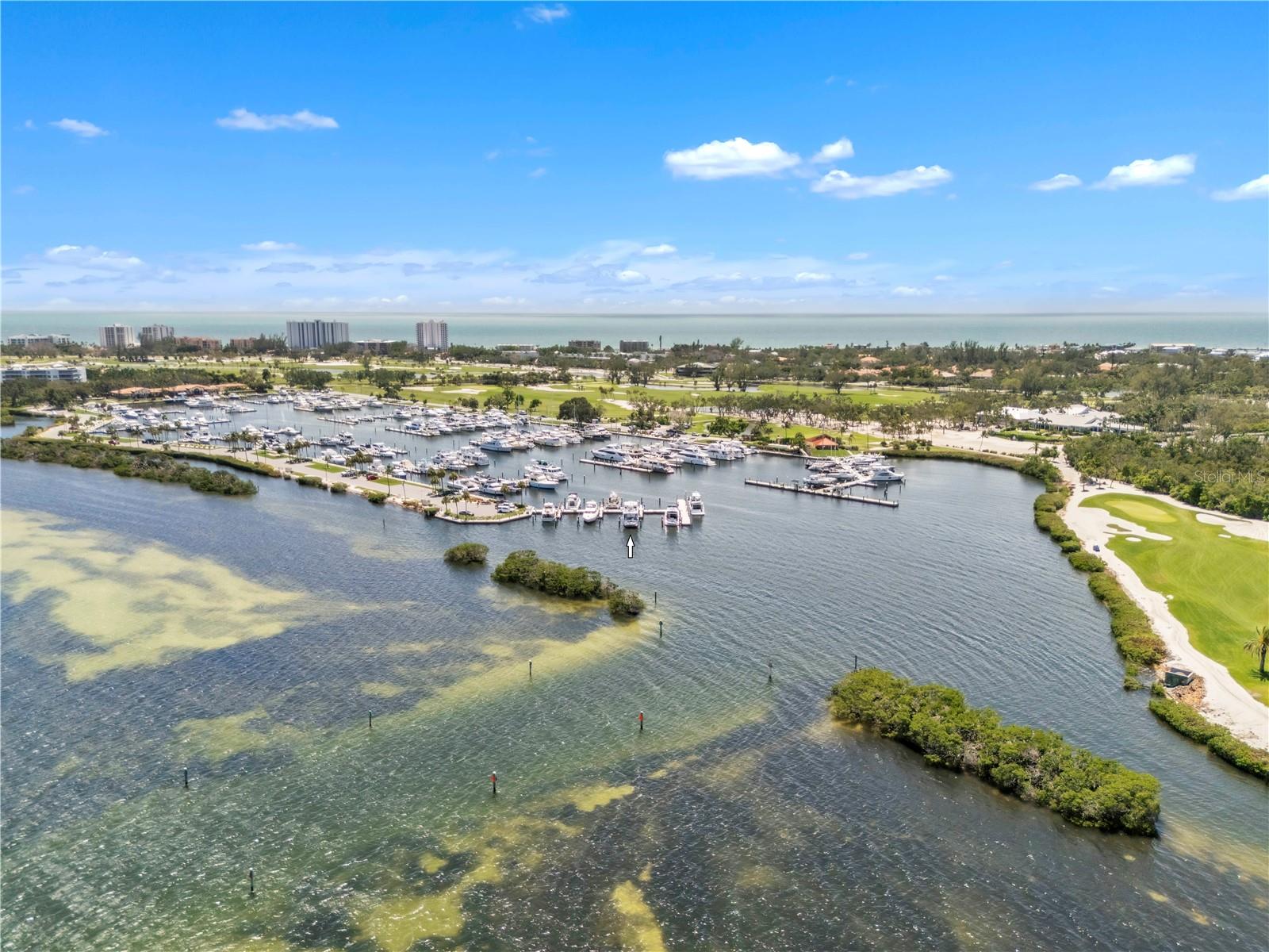Embrace Unparalleled Elegance: Exquisite 75’ Boat Slip on Longboat Key’s premier R dock, Your Gateway to a Refined Gulf Coast Yachting Experience.
Discover the pinnacle of luxury boating with this stunning 75’ x 21’ deep water boat slip, perfectly situated on the spectacular R dock at Longboat Key Club Moorings Marina, nestled along Florida’s breathtaking Gulf Coast. Slip R-9 offers unrivaled views and the closest proximity to the inlet for effortless navigation, with serene waters and vibrant sunsets and the spectacular Sarasota sky line across the bay, as your backdrop—a gateway to an extraordinary yachting lifestyle. Located on Longboat Key, Slip R-9 provides direct access to the Intracoastal Waterway, ideal for deep-sea fishing or leisurely cruises. Enjoy upscale conveniences like Publix, CVS, Chase Bank, a post office, and public tennis courts just moments away. A complimentary shuttle connects you to the chic boutiques and gourmet dining of St. Armands Circle, while you can easily boat to iconic North Longboat Key restaurants like The Shore and Mar Vista, or nearby favorites like Chart House and Dry Dock Waterfront Grill, where fresh seafood and stunning views await. Longboat Key Club Moorings Marina is renowned for its elegance, offering high-speed Wi-Fi, water, laundry facilities, and pump-out services for a seamless experience, with pristine facilities and attentive staff catering to your every need. Visit by boat the nearby sandbars for leisurely afternoons in turquoise Gulf waters, or opt for membership to the Bay Isles Beach Club or Longboat Key Club for access to pristine, sandy beaches and world-class amenities. Unlike other slips, R-9 is not covenanted, meaning Longboat Key Club membership is optional, giving you the freedom to tailor your lifestyle with access to championship golf courses or the exclusive beach club at your discretion. Slip R-9 is more than a boat slip, it’s an invitation to a coastal lifestyle, with quick access to open waters, dining destinations like The Shore and Mar Vista, magical sandbars, and elite recreational opportunities. Own a piece of paradise in this A+ location, where every detail is designed for elegance and ease. Pursuant to condo rule this slip will accommodate a yacht with LOA of 70ft and will be subject to association approval.