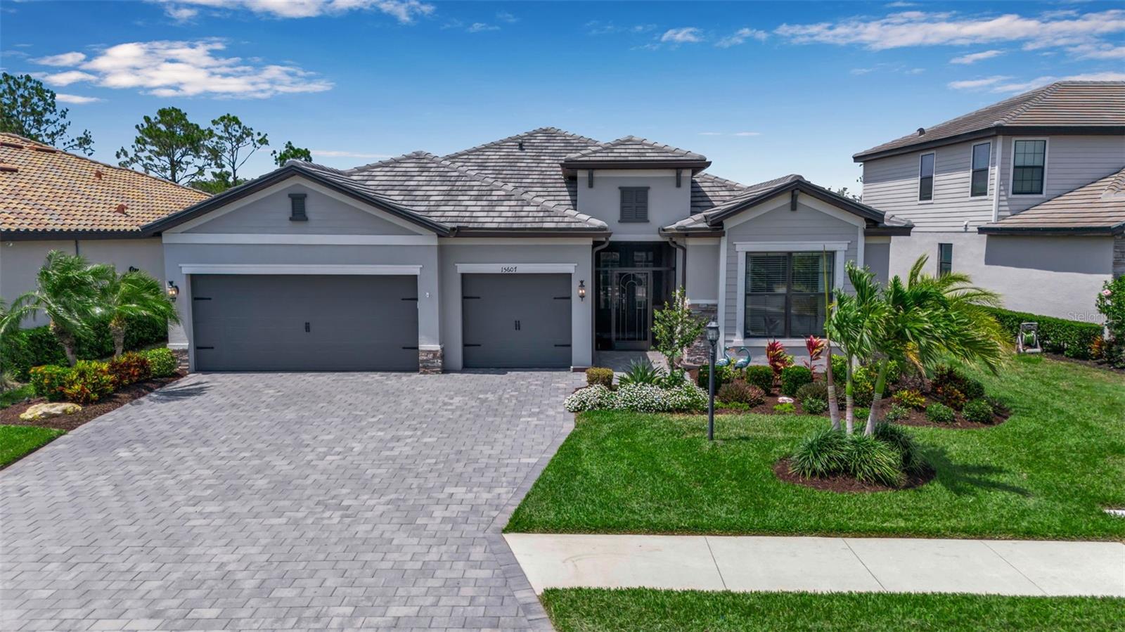 One or more photo(s) has been virtually staged. The Key To Your Luxury Dream Home with One of a Kind Resort Amenities is here in Lorraine Lakes. This 2021 single story Lennar built Summerville model home has been barely lived in & shows like a new home. Value is evident with over $45k in Updates inside and out making this one of the best valued homes in the neighborhood with an incredible backyard oasis. Whether it's for seasonal living or being here full time, this home is a great financial investment with the opportunity to rent annually with a one month minimum requirement. This south facing home sits on a premium private wooded lot with pond views offering the best of both worlds. Neighborhood has sidewalks to explore and offers safe travel to and from the clubhouse for all residents. Top Rated Schools and close to all your shopping, dining and lifestyle needs. Stunning Curb appeal highlights; professional landscaping surround with lightscaping, exterior lighting , three car garage with recently sealed paver driveway, and an upgraded covered screened porch with seating area . Upon entering you'll notice how meticulously maintained this home is along with all the designer touches , spacious bedrooms and oversized windows flooding this home with natural light. Some of the Interior upgrades include; chandelier in the foyer, light fixtures in kitchen & dining room, Hunter Douglas power blinds & window treatments, kitchen backsplash, (4) ceiling fans , bathroom faucets and security system on doors and windows. The "Heart" of this home is the combo kitchen, living room & dining area. These rooms combined are so much larger in person and a must see to appreciate the design and flow. Chef's Designer Kitchen features custom cabinetry with an abundance of storage, stylish hardware, granite countertops, stainless steel appliances and an oversized island with plenty of seating. Dining area off the Kitchen is the perfect space for any dinner parties. The front bedroom off the foyer has an adjacent full bathroom and is away from all the rest for a quiet and comfortable space. The den / office area can be used as a fourth bedroom if needed or can be used as a flex space. Second bedroom has an attached full bath with a walk in shower & plenty of closet space. Spacious primary suite is located in the back of the home with a custom ceiling & direct access to the patio & lanai area. Primary spa bath has dual vanities, two large walk-in closets & a full tile shower. The pool area is the perfect place day or night to relax and enjoy. Three car garage offers plenty of parking along with ample storage for all your needs. Added generator in the garage has hookup for gas and electric if needed. Mudroom / Laundry is located when you enter through the garage. Hurricane shutters & power screen on Lanai available for peace of mind. HOA includes 24/7 gated security and lawn and landscaping maintenance all taken care of for you. *25,000 sq ft Clubhouse offers a coffee lounge, restaurant and bar, dual fitness rooms, sauna, basketball court, playroom & arcade. Outside amenities include; two pools, splash pad, tennis and pickleball courts, playground , putting green, volleyball, bocce ball and basketball . This is Gulf Coast living at its finest in one of the newest neighborhoods in all of Lakewood Ranch.
