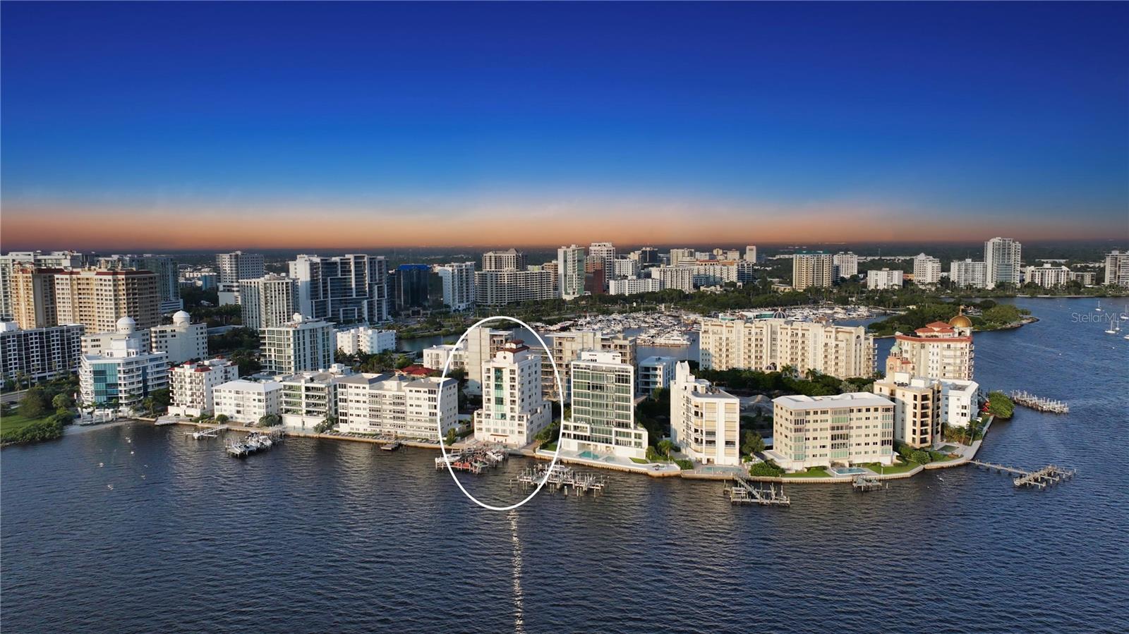 Occupying the entire eighth floor at Majestic Bay Sarasota, this rare three-bedroom plus media room residence defines the art of modern coastal living. Here, panoramic Sarasota Bay views, refined interiors, and the vibrancy of downtown come together in effortless harmony.
Set within the exclusive Golden Gate Point neighborhood—just moments from downtown Sarasota, Bayfront Park, and St. Armands Circle—this home spans over 3,000 square feet of light-filled luxury. Walls of glass showcase sweeping vistas of the John Ringling Bridge, the shimmering bay, and Sarasota’s evolving skyline. Every room offers a front-row seat to the city’s natural beauty—from sunrise over the water to golden evening sunsets and the twinkle of downtown lights.
A secure elevator opens directly into the residence foyer, where travertine floors, high ceilings, and soft neutral finishes set a tone of understated elegance. The open-concept great room connects seamlessly to the dining area and a bay-view terrace, creating an ideal layout for both relaxed living and sophisticated entertaining.
The chef’s kitchen is appointed with rich wood cabinetry, granite countertops, a Wolf gas range, Sub-Zero refrigeration, built-in ovens, and an extended breakfast bar. A cozy morning nook with built-in workspace and east-facing windows captures gentle daylight—perfect for coffee and quiet starts.
The primary suite anchors the northwest corner, offering privacy and stunning water views. French doors open to a private bayfront terrace, while the spacious walk-in closet and spa-inspired bath—with dual vanities, soaking tub, and glass-enclosed shower—create a true retreat. Two additional guest suites, each with en-suite baths, provide inviting accommodations, and a separate media room or office offers flexibility for today’s lifestyle.
North- and south-facing terraces embrace Sarasota’s indoor-outdoor spirit, framing ever-changing bay and skyline views. The residence includes a private two-car garage and a deep-water dock with a 10,000-lb lift—ideal for exploring the Intracoastal Waterway or venturing into the Gulf of Mexico.
Majestic Bay is an intimate, ten-residence community celebrated for its privacy and boutique lifestyle. Amenities include a heated bayfront pool and spa, fitness center, club room, and outdoor kitchen for complete peace of mind.
Outside your door, experience the best of downtown Sarasota living: stroll to the Marina Jack waterfront, Selby Gardens, and The Bay Park, or bike across the Ringling Bridge to St. Armands Circle for shopping, dining, and beach days on Lido Key. The Van Wezel Performing Arts Hall, Sarasota Opera House, and world-class galleries are minutes away, while Siesta Key Beach and the Gulf’s turquoise waters await just beyond.
This full-floor Majestic Bay residence offers an unparalleled combination of space, privacy, and panoramic views—a rare opportunity to own one of Sarasota’s most distinctive addresses and live immersed in the beauty of the bay.