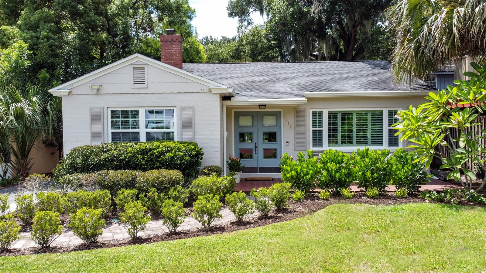 Great Location & Endless Possibilities! This meticulously maintained and beautifully appointed 2 bedroom, one bath home is in the heart of College Park, just steps from Lake Ivanhoe. Zoned R-2/T, the property offers incredible potential—ideal for building a duplex, garage apartment, pool, or expanding on the oversized 50x159 lot. Inside, enjoy an open floor plan with new luxury vinyl plank flooring (2023). The kitchen features custom wood cabinets, stainless steel appliances, island with seating, and built-in microwave overlooking the living room with custom interior shutters. Major updates include: repipe 2023, electrical 2018 & 2023, water heater 2019, fresh interior & exterior paint 2023, utility shed 2023, custom back door 2025, roof 2017, flat roof 2023, plus A/C on a professional maintenance program. Termite bond with transferable warranty included. Surrounded by the charm, walkability, and timeless opulence of College Park living, you’re just minutes to I-4, Advent Health, Downtown Orlando, and Edgewater Drive’s boutiques, cafés, and dining. A rare College Park opportunity to move in, expand, or build!