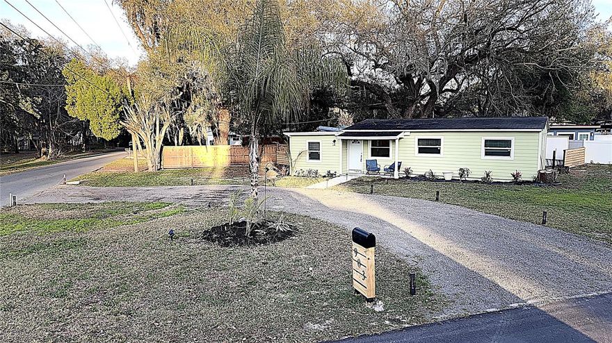 One or more photo(s) has been virtually staged. One or more photo(s) has been virtually staged. One or more photo(s) have been virtually staged. Welcome to 903 King Street, Plant City, Florida — a beautifully upgraded 4-bedroom, 1-bath modern bungalow that blends timeless charm with stylish, contemporary updates in an unbeatable location. LOCATION, LOCATION, LOCATION! Situated in a quiet, family-friendly neighborhood just a couple blocks from Wilson Elementary School (a must drive by to appreciate!) and less than one mile from the I-4 Alexander Street exit, this home offers the convenience of an easy commute—only 15 minutes to downtown Lakeland and under 30 minutes to downtown Tampa. Inside, you’ll find warm, inviting spaces enhanced by wood-look tile flooring throughout (excluding the laundry room), a soft neutral palette, and updated contemporary lighting. The open-concept living and dining areas flow seamlessly together, while sliding barn doors add architectural character and flexible functionality. The fully remodeled kitchen is both beautiful and practical, featuring new cabinetry, a subway tile backsplash, stainless steel appliances, built in seating, perfect for everyday living and entertaining. Abundant storage in the kitchen pantry and dedicated full laundry room adds to the home’s thoughtful design. The spacious primary bedroom serves as a relaxing retreat, highlighted by a stunning wood-plank ceiling, recessed lighting, and generous proportions. Newly installed ceiling fans throughout and energy-efficient windows ensure year-round comfort. Step outside to the rear deck overlooking a large backyard with endless possibilities—ideal for gardening, entertaining, or creating your own private outdoor oasis. Move-in ready