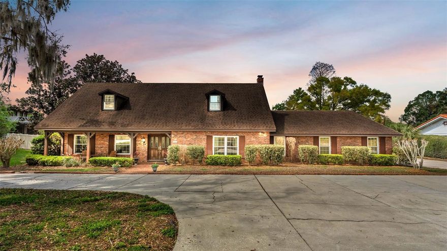 Opportunities like this rarely come available in the gated Lakewood community. This beautifully updated lakefront pool home sits on a private one-acre lot and offers breathtaking sunset views across Lake Otis from your own backyard.
Spend your evenings relaxing on the dock as the sun sets over the water, launch a kayak from the built-in racks, or enjoy weekends boating right from your covered dock. The backyard is designed for Florida living with a resurfaced pool, spacious screened patio, and incredible water views.
Inside, the home offers 5 bedrooms and 3.5 bathrooms, including a highly desirable layout with two primary suites—one upstairs and one downstairs, perfect for guests or multi-generational living.
Major updates provide peace of mind, including a new roof, two HVAC systems, new water heater, new flooring, and new carpet. The home also features all new double-pane impact windows and sliding doors, a newly resurfaced and retiled pool, and a new covered dock with kayak storage. The irrigation system pulls directly from the lake, so watering your lawn is never restricted by city water rules.
Recent improvements include a re-screened patio, new gutters, new garage door, and a new privacy fence, making this home move-in ready.
Imagine ending every day watching the sunset over Lake Otis from your own backyard. Homes like this rarely come on the market—schedule your private showing before it’s gone.