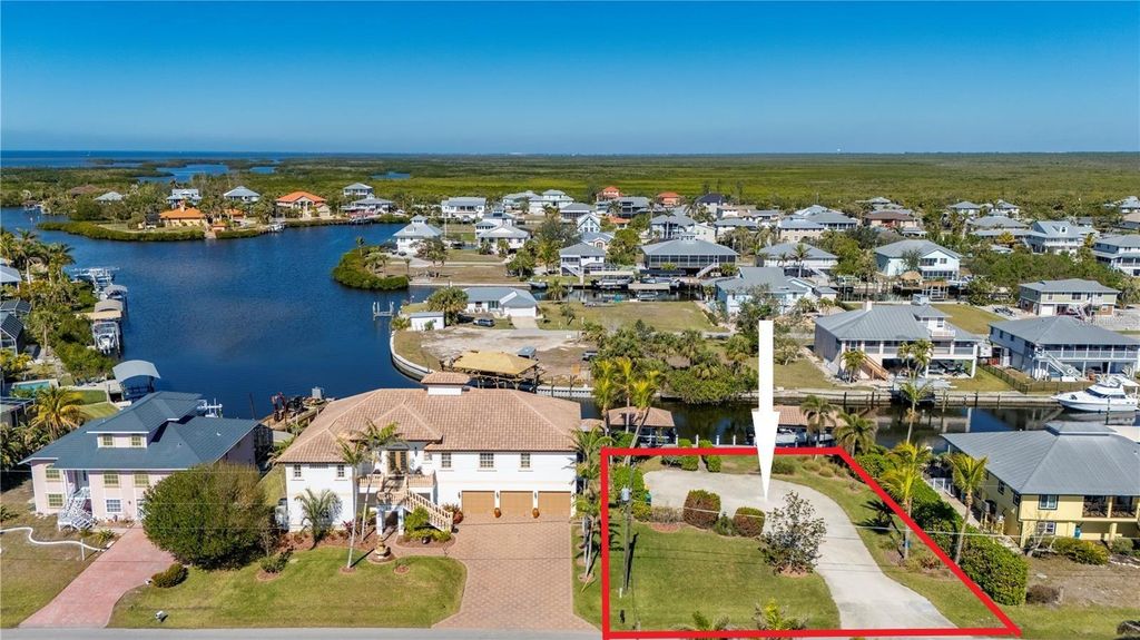 Photo of 24258 Treasure Island Boulevard, Punta Gorda, FL 33955 (MLS # A4679684)