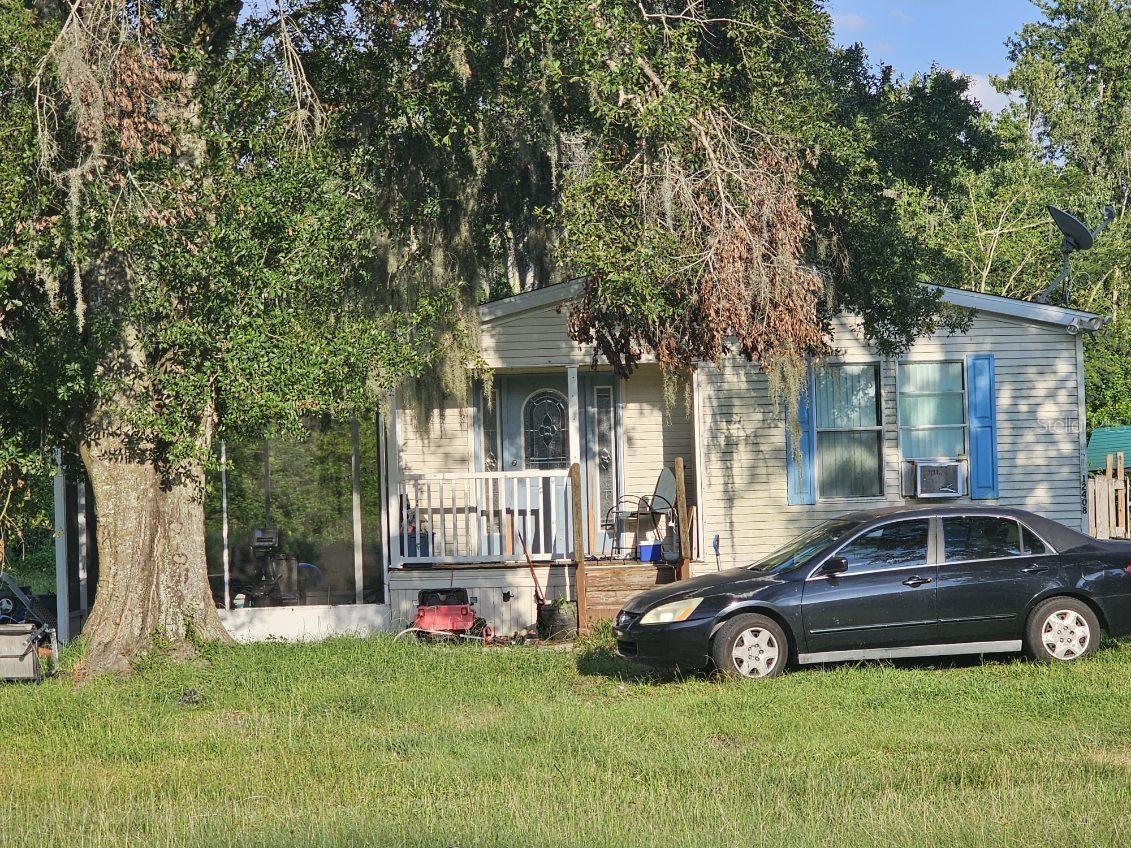 Calling all investors and any handyman homeowners! This manufactured home features 2 bed, 2 bath and sits on a spacious 1.1 acre of land that is accessed via a paved road. Property is sold “AS IS”. There are no HOA fees or lot rent. Home will need some TLC. This property offers a lot of potential for the right buyer. . Perfect opportunity for a renovation or to replace the home and start fresh. Make this your new home and design it as you wish. SCHEDULE YOUR SHOWING TODAY WITH THE LISTING AGENT. *** Tenant will be moving August 1st. ***
