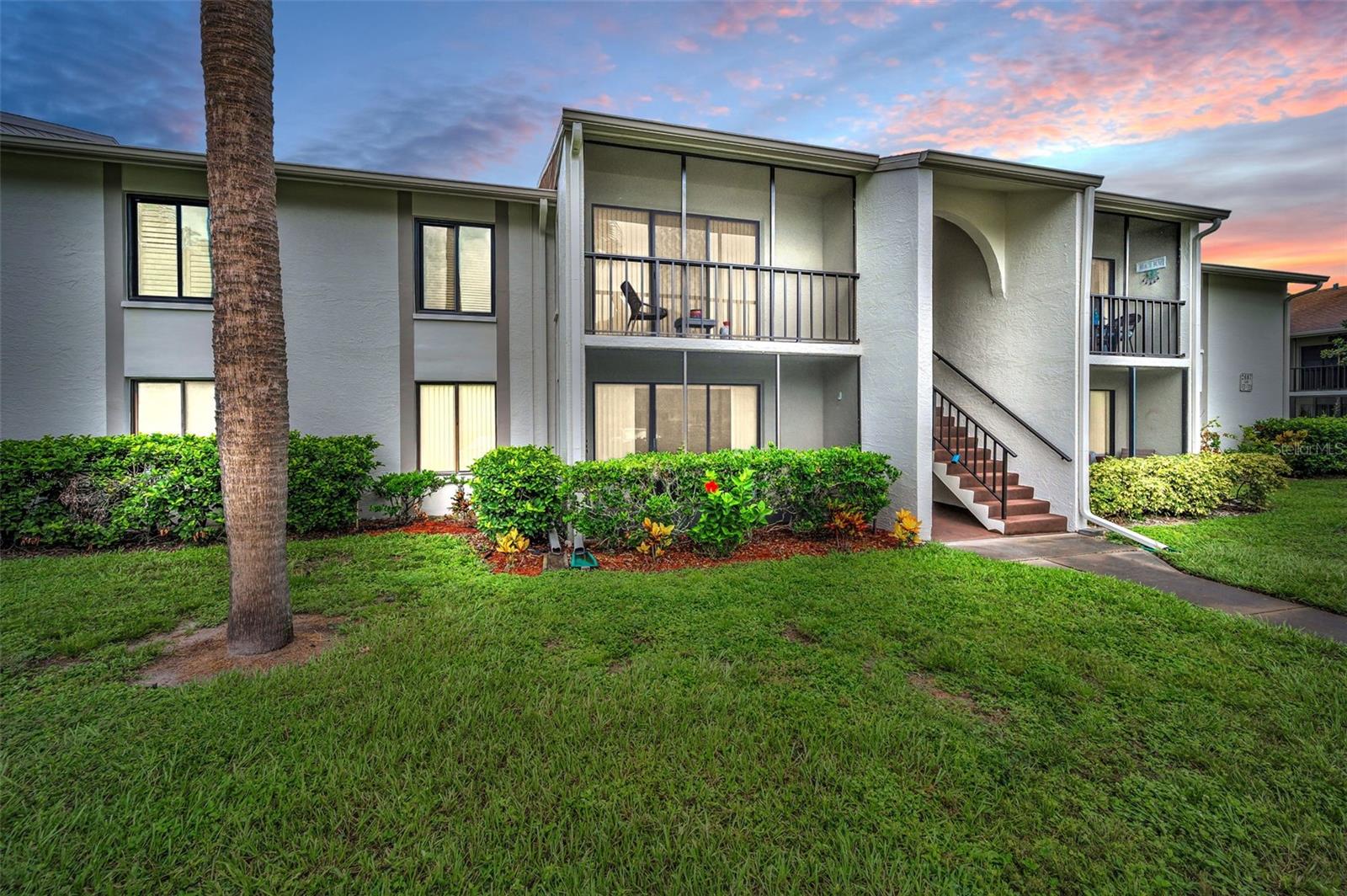 One or more photo(s) has been virtually staged. Welcome to this beautifully maintained one-bedroom, one-bathroom condominium located in the desirable Pine Ridge at Palm Harbor—a pet-friendly retirement community offering comfort, convenience, and a vibrant lifestyle. This move-in-ready residence exudes modern elegance and is privately situated at the rear of the complex, showcasing true pride of ownership. For use as your primary residence, vacation home or investment property with no wait-time to rent! The interior features luxury vinyl plank flooring throughout, creating a seamless and stylish look. The kitchen is a dream with solid Shaker style cabinetry, glass tiled backsplash and newer appliances. The well-designed bathroom offers dual access from both the hallway and the spacious primary bedroom, which also includes a generous walk-in closet. The living room has a slider door to a quaint patio, covered and screened. A Newer HVAC system (2024) and hot water heater for your peace of mind. 805 sqft. includes the covered patio. Low HOA fees (334.06) include: roof, cable, internet, sewer, trash, water, external pest control, external maintenance, Heated Pool and Spa, Shuffleboard court, Clubhouse, walking trails and an on-site manager. Pine Ridge is a great location near restaurants, shopping, medical and dental facilities, beaches, Honeymoon Island and more! All room dimensions approximate. Call today for your in-person or live virtual tour today!