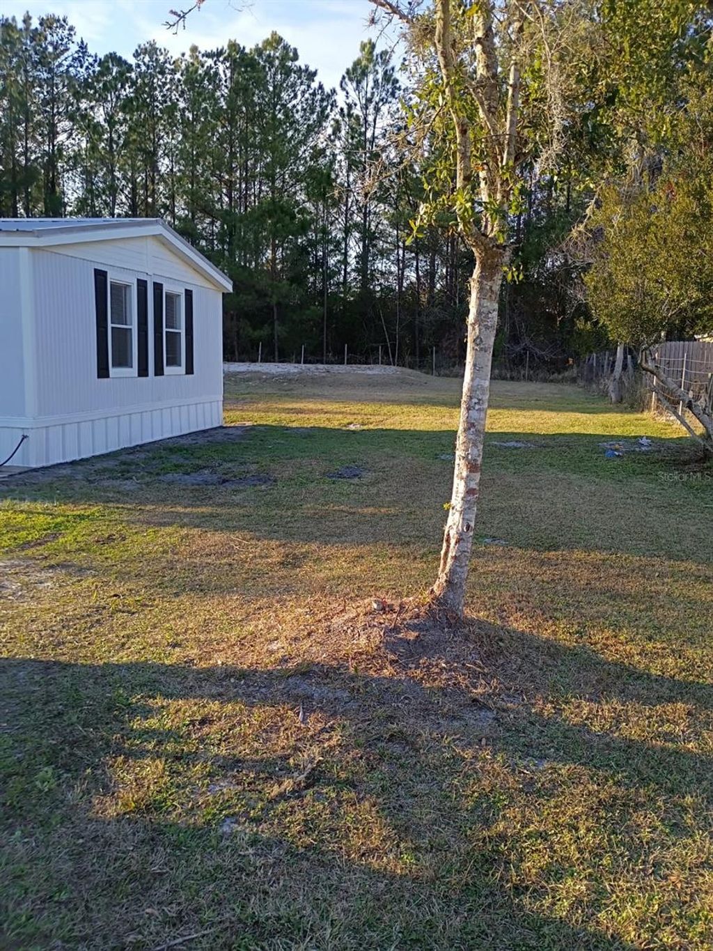 Photo of 140 Coolwater Ave, Satsuma, FL 32189 (MLS # S5141983)