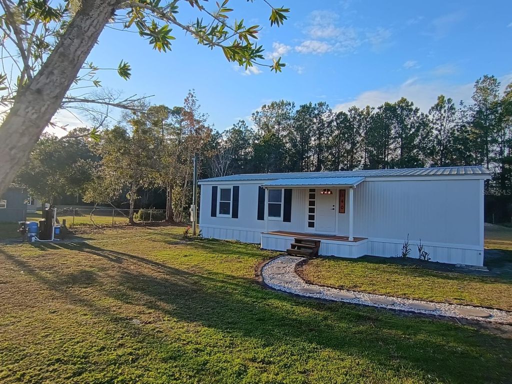Photo of 140 Coolwater Ave, Satsuma, FL 32189 (MLS # S5141983)