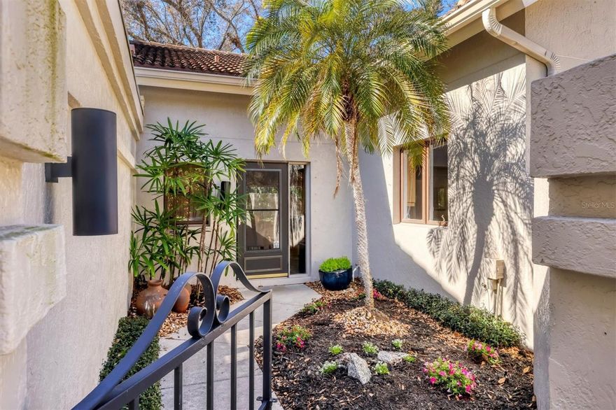 Step through the iron gate into the front garden courtyard and discover a private retreat with a peaceful interior, long lake views, and mature trees. This 2-bedroom, 2-bath home is professionally decorated with carefully chosen furnishings that create a calm, welcoming atmosphere as you move from room to room, blending indoor and outdoor spaces. Sunlight shines through the trees, making the lanai a perfect spot to relax. You might even want to add an outdoor spa to the screened lanai for evenings with bubbles and a glass of champagne. The home comes with hurricane shutters, a new HVAC system (2024), a new water heater (2023), an interior laundry room with a full-sized washer and dryer, plenty of closet space, and is sold furnished for your convenience. The second bedroom is set up as a den with a Murphy bed for guests. Floor-to-ceiling mid-century-style windows and high ceilings give the home an open, inviting feel. The location is excellent, just 11 miles from local beaches, less than 2 miles from the UTC mall, and close to a wide range of restaurants. Nearby, you'll also find Walmart, Publix, Whole Foods, Macy’s, Marshalls, TJ MAXX, and Home Depot. Residents enjoy the community’s tropical setting, mature trees, and paved trails, which are great for walking, exercising, or taking your dog out. The neighborhood fees cover exterior insurance, roof replacement and repair, exterior pressure washing, pest control, grounds and irrigation maintenance, and reserves. This is an estate sale that’s ready to close, and the motivated seller says, “Let’s make a Deal!