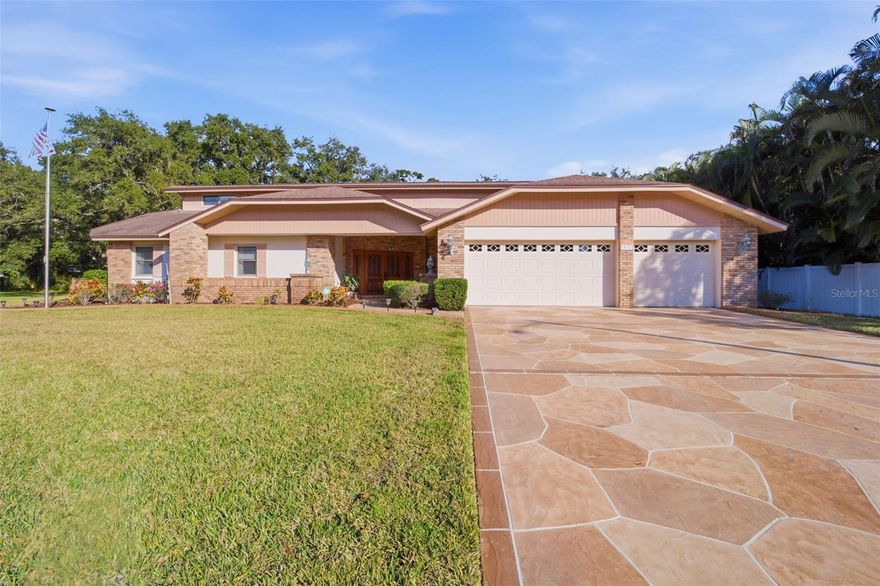 Welcome home to BARRY ESTATES, a highly sought after neighborhood that rarely comes available! This 1-OWNER, CUSTOM-BUILT home is situated on an .5 acre OVERSIZED LOT in a NON-FLOOD/NON-EVAC ZONE, and offers OVER 3200SF of living space. Very well-maintained and loved by the owners through the years, this home offers you the opportunity to focus your updates on the fun stuff. You won't find a more spacious and unique home as your canvas! The primary bedroom includes an oversized en suite bathroom with jetted tub, dual sink vanity, separate shower and WC; as well as a PRIVATE LOFT/OFFICE and HUGE walk-in closet. The 2nd and 3rd bedrooms are located in a separate wing with close proximity to the 2nd bathroom which includes dual sinks and a shower/tub combo. The living spaces of this home all open onto the expansive NEWLY SCREENED LANAI with SOLAR HEATED POOL/SPA and also include a pass-through window to the kitchen. Enjoy both formal living/dining space as well as the GREAT ROOM layout of kitchen, family and casual dining room. Both of which include beautiful STONE FIREPLACES and SOARING CEILINGS. In addition, there is a very spacious BONUS ROOM with attached FULL BATH and POOL ACCESS, which could easily become another OWNER'S RETREAT. The 3-CAR GARAGE accesses the home through a LARGE LAUNDRY ROOM with tons of storage and wash sink. Also included is a GENERAC GENERATOR. The POSSIBILITIES for the future of this home are VERY EXCITING! This home is a FOREVER HOME and is waiting for its NEW FAMILY to come and love it!