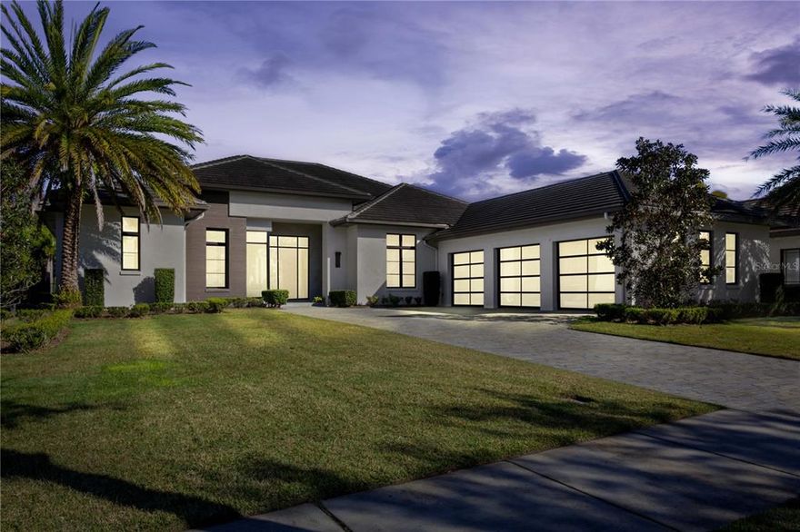 This beautiful single-story home sits in close proximity to the shores of Lake Nona within the gates of Lake Nona Golf & Country Club. Built by Maroon Fine Homes and designed for indoor and outdoor living, this home offers four bedrooms, four full and one-half bathrooms and features over 4,200 square feet of interior living space overlooking sparkling water views. 
Featuring Florida modern architecture and accented by contemporary interior design, the home offers a blend of hospitality and sophistication. Elegant wood floors travel throughout the interior, from the foyer and great room to the kitchen, dining room and study. Accented by beautiful finishes including smooth stained beams and crown molding in the great room, along with tongue-and-groove ceilings on both the front porch and rear lanai, this home’s intricate details further enhance the primary living areas. A substantial kitchen overlooking the great room offers a walk-in pantry, center island and appliances by Thermador. 
This stunning luxury home boasts the highest level of modern full home automation, ensuring that every aspect of your home is at your fingertips. The air conditioning is zoned to each room, allowing you to control the temperature of each space individually with the use of independent thermostats. From the unique custom details to the fiber optic connectivity throughout the home, this property has been built with only the finest materials. In addition to these impressive features, the home also boasts a state-of-the-art in-ceiling sound system that extends throughout the entire property so you can relax in ultimate comfort in this multi-million-dollar dream home. The home’s outdoor living area features a tranquil salt water pool and heated spa, along with a covered summer kitchen including outdoor dining space. This peaceful retreat creates the perfect place for outdoor entertaining or relaxing pool side while enjoying the view. 
This home is conveniently located just a short distance from the Clubhouse, Bath & Racquet Club, and golf training facility, providing members easy access to all the amenities, further elevating the lifestyle that this vibrant community offers. With close proximity to the Orlando International Airport and the prestigious Lake Nona Medical City, this property is the perfect combination of luxury and convenience. Room Feature: Linen Closet In Bath (Primary Bedroom).