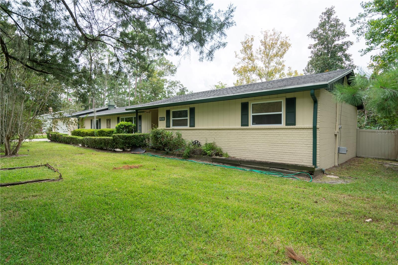 Come and see this Large and updated 3 bedroom, 2 bathroom home in NW Gainesville with a pool and no HOA! This home sits on almost a half an acre lot with a completely fenced back yard ready for your pet or pool party! The interior is large, newly painted with an updated kitchen with granite tops. Aside from a large kitchen and Dining combo, it has 2 family rooms/den and a separate living room too! Situated near Hwy 441/13th Street, it is conveniently located near restaurants and shopping and is a short commute to UF. Come and make this home yours!
