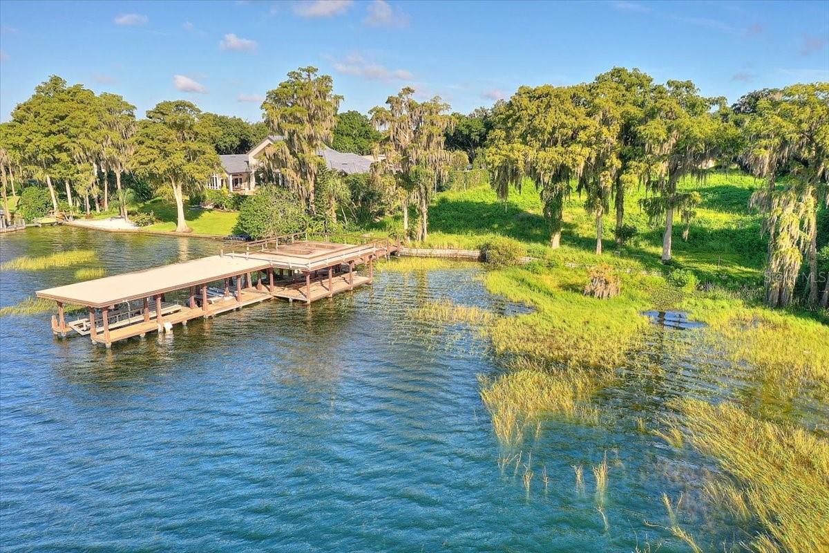 WELCOME TO PARK AVENUE. This tremendous opportunity offers 2.19 acres of sprawling possibilities with Southeastern exposure and sweeping lake views. Nestled on the gorgeous shoreline of Lake Butler among the famed Butler Chain of Lakes, within one of Windermere’s most desirable communities - Chaine Du Lac – this exclusive homesite truly has it all. The gates within the gates that this property offers ensure that the estate that is built here will boast both privacy and security. With over 200 feet of lake frontage and amazing water views you will get to enjoy all of the beauty, nature and wildlife that Florida lake living has to offer. There is a Brazilian hardwood boat dock that leads out over the lake and includes a 2000SF observation deck, boat and jet ski hoist. The property also features private launch access for your personal watercraft and a 3’ concrete seawall. The opportunities to build your dreams into reality are limitless. Schedule your showing today!