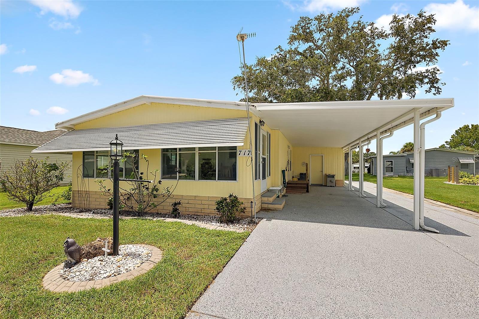 NO BOND OR CDD!! 2 Bedroom, 2 Bathroom, 1 Car Carport with laundry utility room. This TURNKEY Manufactured home in the Village of Orange Blossom Garden offers a spacious kitchen with tile floors & dining room. Living room opens to the enclosed lanai with windows for natural light. Owner's suite is spacious with 2 closets and en suite bathroom. The enclosed storage area includes a laundry space with washer and dryer, workshop with tools and ample shelving with a carport for parking. House painted 2 years ago. Paid pest service through the end of the year. The community pool and golf courses are just steps away. Only a 5-minute golf cart ride to Spanish Springs Town Center, shopping, and entertainment! Rubber membrane Roof 2005, Air conditioner 2018. Come experience the Florida Lifestyle in THE VILLAGES. Call today for a showing.