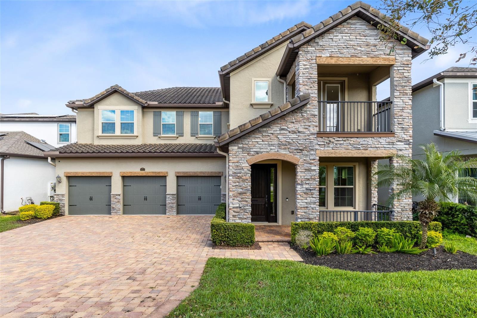 Discover 1675 Amsel Falls Park Terrace, a home where elegance meets everyday comfort, perfectly set on one of Twinwaters’ most coveted conservation lots.
This Meritage Lafayette model offers the rare combination of privacy, stunning sunrise views, and thoughtful upgrades in every corner. Step through the grand wood entry door and you’re immediately welcomed by soaring ceilings, gleaming imported porcelain tile, and walls of windows that flood the space with natural light.
A refined sitting area just off the foyer creates the ideal spot to greet guests or enjoy a quiet moment. The formal dining room sets the stage for memorable dinners with its custom herringbone accent wall and contemporary lighting. At the heart of the home, a dramatic two-story great room draws your attention with its sleek electric fireplace and expansive glass sliders opening to serene conservation views.
The kitchen is designed to impress, from quartz countertops and ceiling-high cabinetry with glass accents to the wine fridge, walk-in pantry, and premium stainless steel appliances. A charming breakfast nook captures the morning sun, making everyday meals feel special.
The primary suite, privately tucked away at the back of the home, is a true retreat with tray ceilings, soft ambient lighting, and direct views of the lush backyard. Its spa-like bathroom offers dual vanities, a soaking tub, walk-in shower, and a custom-fitted closet for seamless organization.
Upstairs, engineered hardwood floors lead to a spacious loft, a game room, and three generous bedrooms, each with its own walk-in closet. A cozy sitting area opens onto one of the community’s rare balconies, perfect for enjoying evening breezes.
The motorized screened lanai extends your living space outdoors, providing the ideal spot for dining, relaxing, and savoring unmatched privacy. Additional highlights include built-in ceiling speakers in the foyer, a pre-wired media room, two powder baths, laundry with sink plumbing ready, attic access, and plenty of storage throughout.
All this in a prime location close to top-rated schools, Hamlin, Downtown Winter Garden, Disney, and the upcoming Olympus project, plus neighborhood amenities like a resort-style pool, playgrounds, and scenic walking trails just minutes away.