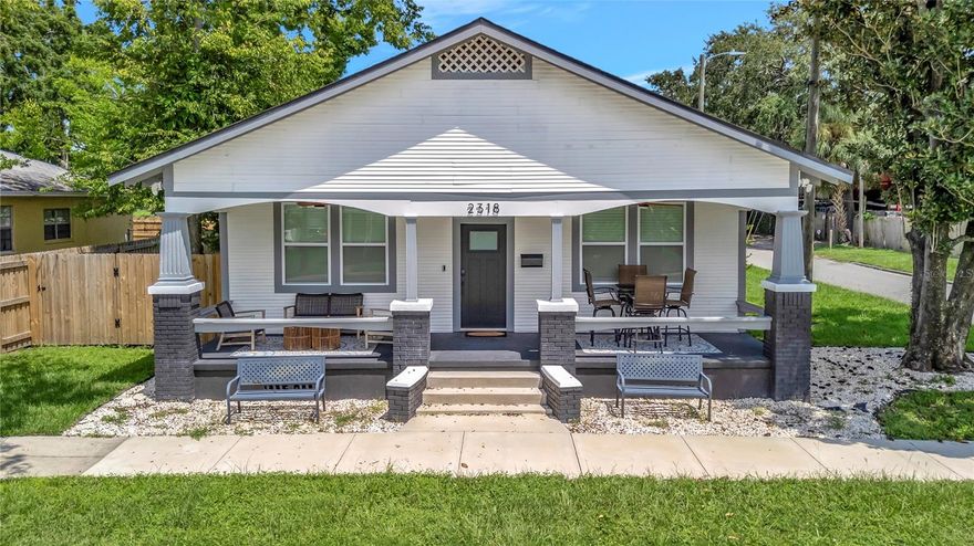 Historic East Ybor 1920s Bungalow – Fully Rebuilt from the Studs Up! Yes, that is Correct - essentially a new home within a 1920s historic shell! This magnificent bungalow has been completely reimagined and rebuilt, blending historic character with new construction quality. Every major system is new, including electrical, plumbing, HVAC, drywall, insulation, exterior siding, and roof. Hurricane-impact windows with vapor-barriered sills and impact-rated doors add modern safety and efficiency. The designer kitchen features 42-inch upper cabinets, a large waterfall-style center island, with microwave drawer and quartz countertops. The entire home is finished with luxury plank-style vinyl flooring. Inside, you’ll find two en-suite bedrooms, two additional bedrooms, an additional full bath, and a dedicated workspace or flex room. The paved back patio creates an ideal space for entertaining. Located near the Columbia Restaurant, Casa Santo Stefano, and the ongoing revitalization of Ybor City with such things as the Gas Worx Development, Ybor Harbor, Future soccer stadium, Tampa General expansion and so much more, this home offers the perfect blend of history, craftsmanship, and modern comfort. Did I mention that the home comes fully furnished and turnkey ready to move right in? Yes, just bring your toothbrush and move on in!