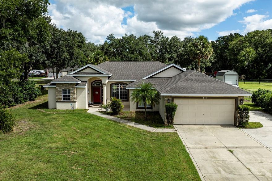 This Beautiful Home checks all the boxes! 4 Bedrooms | 2 Bathrooms | Saltwater Pool | RV Parking with hookups and/or Boat Parking with Cover | No HOA | Oversized lot - .60 Acres | New Roof 4/2023. Welcome to 114 Wingfield Drive in Umatilla, FL. This beautiful home has so much to offer. Located in an amazing location with no HOA and on a quiet street where you can enjoy an evening walk with beautiful views of Lake Ella. This custom home was built in 2004 and has been updated through the years.  Need space for your toys? This home has it covered—literally! There’s RV parking area with 50-amp hookup, covered boat parking, and an oversized driveway that accommodates all your vehicles with ease. Shed stays with the home for additional storage. Step outside and enjoy Florida living at its finest! The saltwater pool is the centerpiece for unforgettable gatherings on warm days, while the expansive backyard provides plenty of room for play or relaxation. The home features a split floor plan with 4 bedrooms, 2 full bathrooms and a 2-car garage. As you enter the home you're greeted with tall ceilings and lots of natural light. The formal dining and family room are perfect for entertaining and holidays. The kitchen has granite countertops with plenty of room for meal prep, lots of storage with two pantries and lots of cabinet space. The primary suite is a relaxing retreat, complete with poolside access, dual closets, and a luxurious en-suite bath featuring a soaking tub, separate shower, and private water closet.  The additional 3 bedrooms each have ceiling fans with carpeted floors. The guest bathroom offers dual sinks and a tiled bathtub. If a pool home with room for your toys and no HOA is what you are shopping for then you just found it! Opportunities like this do not come along often...Do not wait to tour this home! All information recorded in the MLS is intended to be accurate however, it should be independently verified by buyer and their agent. Check out the Virtual Tour!