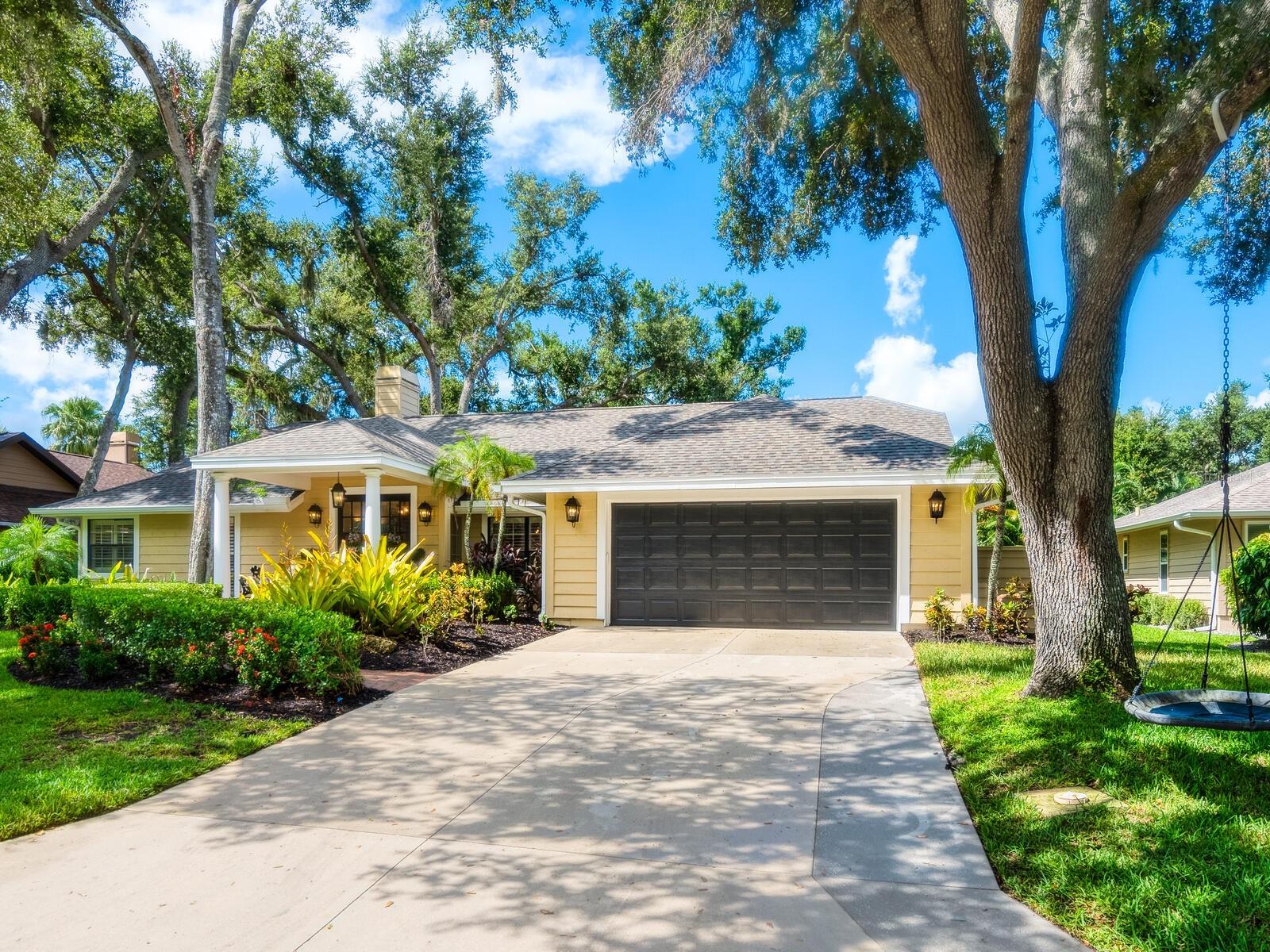 Proudly Introducing Gracious Elegance in The Lakes Estates. Welcome to this beautifully designed, true 5-bedroom, plus office space off the primary bedroom, 3-bath residence offering 3,364 square feet of nicely appointed and thoughtfully planned living space. No pool, no worries, the community pool is only 50 yards away. Showcasing timeless architecture and traditional charm, this home blends classic elegance with everyday comfort. A brick-floored portico and double glass doors create a gracious welcome, opening to an inviting foyer that sets the tone for the refined interior. The formal living room features a cozy fireplace and French doors, ideal for both quiet evenings and entertaining. Designed for both style and function, the island kitchen boasts stone countertops, high-end appliances, a breakfast café with buffet and wine cooler, and opens to a spacious family room with custom built-ins and a second fireplace. Plantation shutters, cathedral ceilings, and skylights add light, warmth, and character throughout. The generous primary suite is a true retreat with a customized wardrobe room and a spa-like bath with double vanity, soaking tub, and separate shower. Adjacent to the suite is a handsome office with built-ins and French doors. A delightful sunroom with floor-to-ceiling windows spans along the rear of the home, offering serene views and seamless access to an outdoor entertaining patio with grilling station and fire pit. Lush landscaping surrounds the property, creating a peaceful, shaded sanctuary. Additional highlights include a formal dining room, 2 car garage and spacious lot offering privacy and curb appeal. Located in one of Sarasota’s most sought-after deed-restricted communities, The Lakes Estates offers an exceptional lifestyle with tree-canopied streets, nature preserves and lakes, and resort-style amenities—including 2 swimming pools, tennis courts, fitness center, clubhouse, playground, and scenic walking trails. Enjoy unmatched convenience from this central location with easy access to UTC mall, I-75, Lakewood Ranch business parks, public Bobby Jones Golf Club and Urfer Family Park. The Lakes also hosts an active social calendar with Saturday coffee hours, family game nights, bingo, holiday events, and more—making it more than a neighborhood; it’s a true community where neighbors become friends. Living here means embracing a lifestyle that blends natural beauty, coastal charm, and cultural sophistication. From world-renowned beaches to the lively arts and theater scene, residents enjoy the perfect balance of relaxation and enrichment. Whether you're exploring boutique shops at St. Armands, kayaking through mangrove tunnels, or attending a performance at the Van Wezel Performing Arts Hall, every day brings new possibilities. With year-round sunshine, championship golf, award-winning schools, and a strong sense of community, the area offers an elevated yet laid-back lifestyle that’s truly one of a kind.