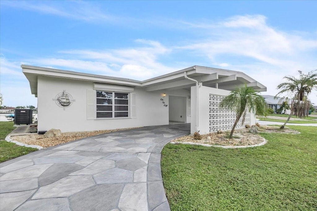 Photo of 168 Morgan Lane SE, Port Charlotte, FL 33952 (MLS # C7531219)