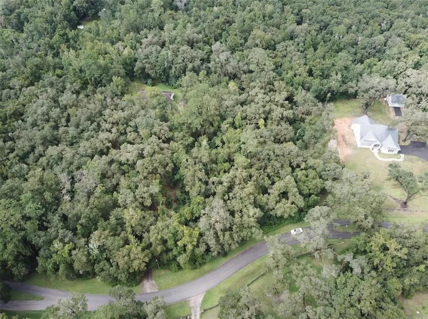 Discover the perfect opportunity to build your dream home on this 2.5-acre lot in Brooksville, Florida, nestled in a quiet, private, and
well-established neighborhood surrounded by natural beauty. Enjoy peaceful living while still being conveniently located near I-75,
approximately 45 minutes from Tampa, about one hour from Tampa International Airport, and within an hour of Orlando’s world-class
attractions. This spacious property offers ample room to design and build while maintaining privacy and tranquility, with nearby
access to local shops, dining, and outdoor recreation, an ideal balance of space and seclusion.