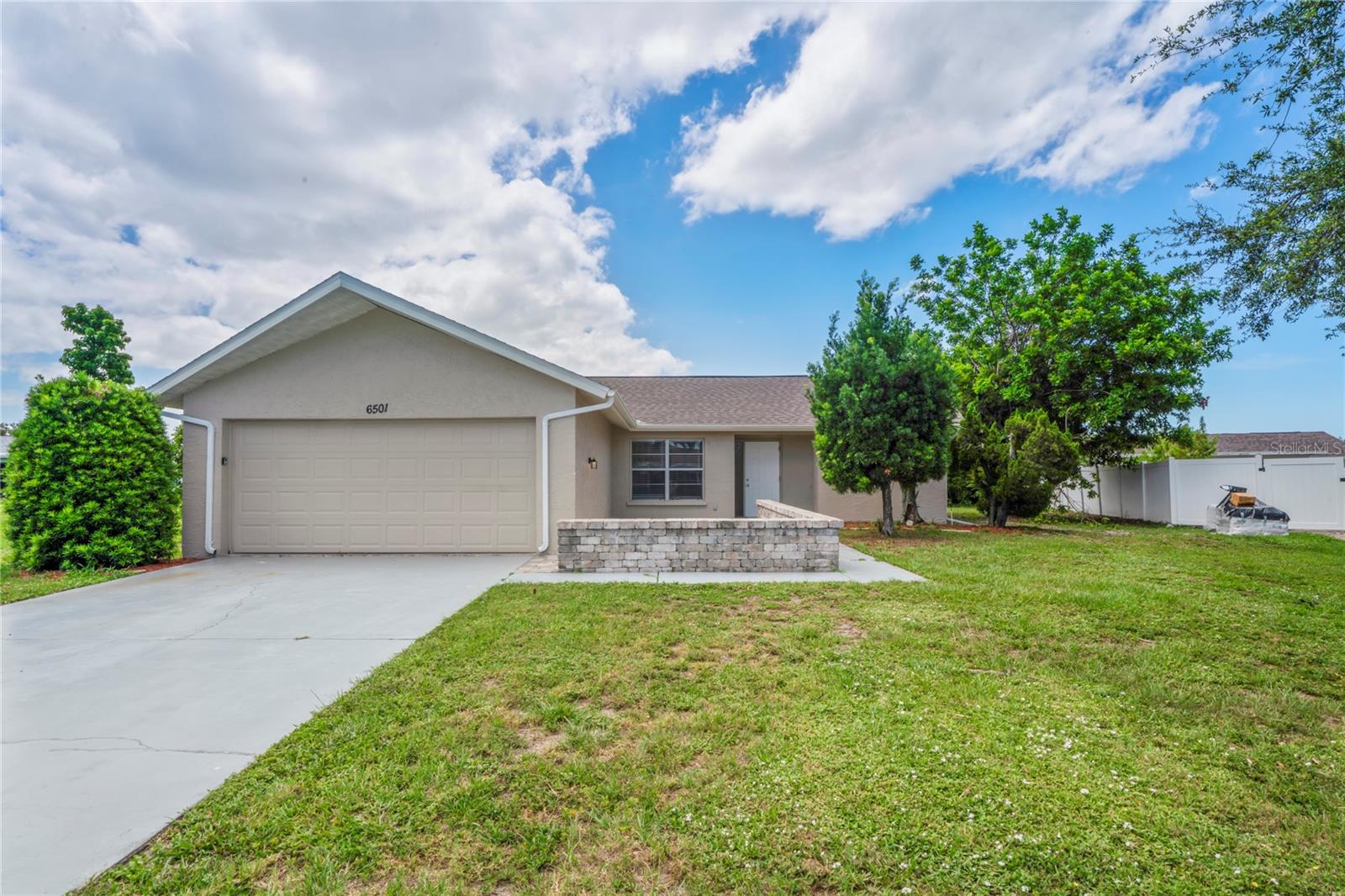 Welcome to 6501 14th Ave W! This 3-bedroom, 2-bathroom home is located in the sought-after community of Village Green of Bradenton with an Optional HOA and offers nearly 1,500 sq ft of living space. The home features a two-car garage, dedicated laundry room, and split bedroom floorplan. Upon entering the foyer, you’ll be welcomed with modern luxury vinyl plank flooring and updated paint throughout. The living room and dining areas offer plenty of room for entertaining and flow seamlessly into the kitchen. The updated kitchen features quartz countertops, stainless steel appliances, and white shaker-style cabinets. The primary bedroom includes an en-suite bathroom and walk-in closet. The two additional bedrooms share a second full bathroom. Conveniently located near schools, shopping, and major roadways. Call to schedule a showing today!