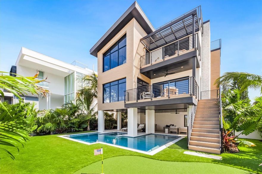 Anna Maria luxury at its finest! This 3,155 square foot, spectacular bayfront estate provides the perfect combination of privacy and coastal elegance on the prestigious North end of Anna Maria Island. When you enter this beautiful home, you will be enchanted by the amazing views of the crystal blue waters of Tampa Bay that greet you from every room in the home. This sprawling 3-story home contains 4 bedrooms, 4 1/2 bathrooms, custom built bunk room, open floor plan, elevator, large terraces and a rooftop deck with views that stretch from Tampa Bay to the Gulf of Mexico. The home also has 2 gas fireplaces, multiple balconies, and an oversized two-car garage. The finest touches and finishes encompass every corner of this home. This home shows like a priceless work of art! The master suite is impressive with its built-in automated shades, exquisite ceiling, large walk-in closet and private lanai. Gourmet kitchen designed for entertaining with a walk-in pantry.  Stepping outside the home, you will fall in love with the lush tropical landscaping and artificial turf lawn, which provides that look of perfection combined with the ease of minimal maintenance. The outdoor living space includes a large covered patio, fireplace, saltwater pool and spa and even a putting green for the golf enthusiast. Not only are the indoor and outdoor finishes and fixtures of this home spectacular, but this home comes fully furnished with beautifully appointed custom furniture, upholstery and window treatments. You will not want to miss out on your chance to own one of the most elegant, unique and exquisite homes on Anna Maria Island.  Walking distance to the boutique shops and restaurants of Pine Avenue, city pier, farmers market and the white sand beaches.