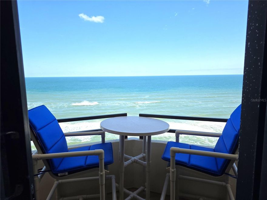 Enjoy an elevated coastal lifestyle in this meticulously crafted home featuring an expansive open floor plan and floor-to-ceiling windows that fill the space with natural light and showcase sweeping ocean and intercoastal views. Every room accesses an impressive 80-foot wraparound balcony, perfect for golden sunrises and vibrant sunsets, gentle breezes, and soothing waves. The contemporary kitchen offers rich wood cabinetry and storm shutters, blending elegance and security. Residents benefit from luxurious amenities: a sparkling pool, direct beach access, fitness center, communal grills, spacious community room, and secure parking. Walkways lead to the shoreline, scenic biking routes, and nearby Andy Romano Park for recreation. Located at the border of North Daytona and Ormond Beach, this home is minutes from shopping and the iconic drive-on beach, delivering adventure and convenience at your doorstep.