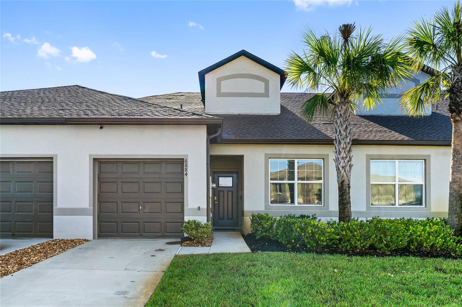 Welcome to this modern and trendy Villa, as you arrive, you'll notice the resort-style living complimented by the contemporary exterior. You're greeted with charm as you walk into the home of this 2-bedroom, 2-bathroom plus a large and spacious bonus / flex room in this villa, in the gated community at Abbott Square. The open floor plan seamlessly flows into the living, dining, and kitchen areas, delivering a bright and comfortable area for relaxation and gatherings while entertaining. The designer kitchen includes shaker cabinets, granite countertops, and energy-efficient appliances allowing for all to be engaged effortlessly. Right off the kitchen the primary suite offers a spacious room with luxury tile floors, an en-suite bathroom with dual vanities, and a walk-in closet. The en-suite features a large shower & modern fixtures, elevating the space making it feel high end. A second bedroom near the laundry room also offers versatility and luxurious tile floorings durability and very ideal for guests also creating tons of space and adding separate privacy. The home also includes a dedicated laundry area equipped with a washer & dryer, making everyday chores simple and efficient. The backyard is a private retreat with lush landscaping to unwind and just enjoy the outdoors. With hassle free maintenance you'll have a lot more time to just enjoy.
The HOA covers internet, lawn care, exterior maintenance, and pest control giving you a true hands-free lifestyle experience without the hassle of regular upkeep. There is a load of activities and amenities, including an over-sized pool, a water splash park, fitness center, grilling stations, scenic walking trails, picnic areas and gazebos and much more to take advantage of FL lifestyle outdoors. Nestled in a peaceful neighborhood with easy access to restaurants, shopping, gyms, malls, and major highways, this move-in ready home combines comfort, design, and convenience. Don’t miss this opportunity to own a vibrant turnkey home today! Schedule your showing now and see what all the hype's about!